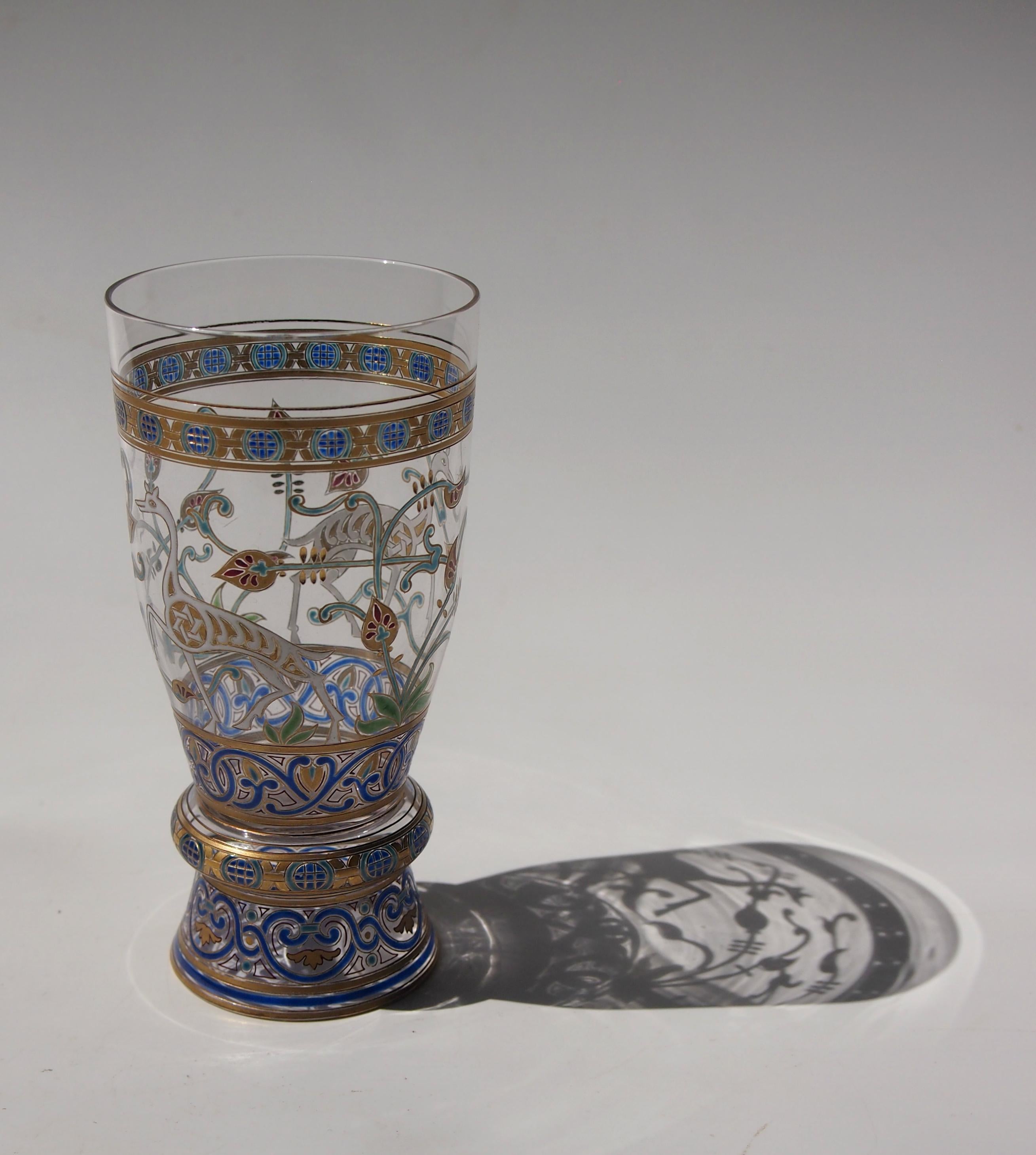 An Important signed gilt and enamelled Islamic glass goblet by J & L Lobmeyr circa 1870 depicting Islamic calligraphy, stylised decoration and 'deer' with the star of David. It is enamelled in blue, white, green, red and gold and signed in gold (see