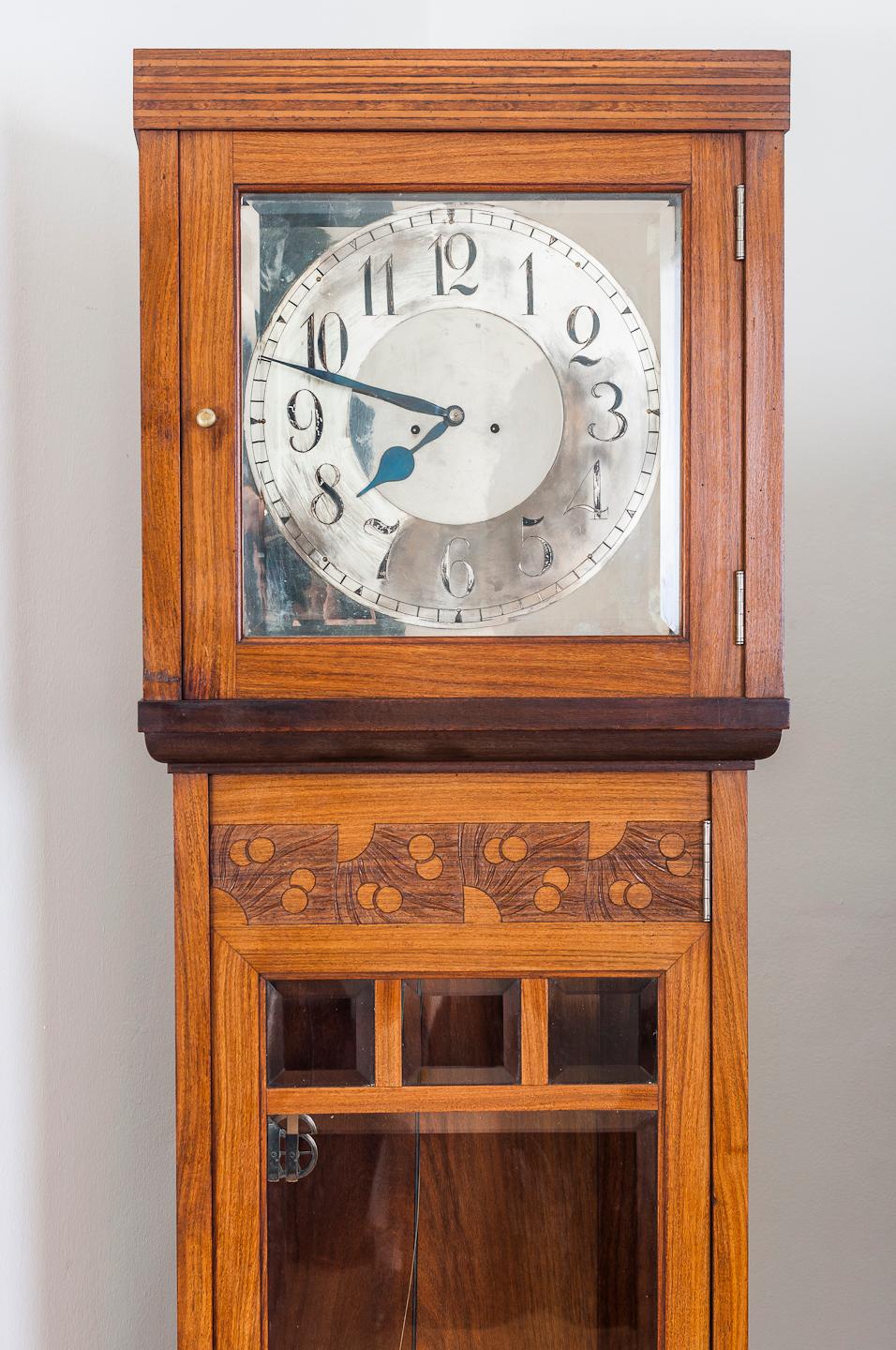 This long-case clock is designed by Koloman Moser. It is a part of the dinner set which included the clock, large and small sideboards, a dining table and six chairs.
The famous Viennese furniture firm August Ungethüm manufactured such sets between