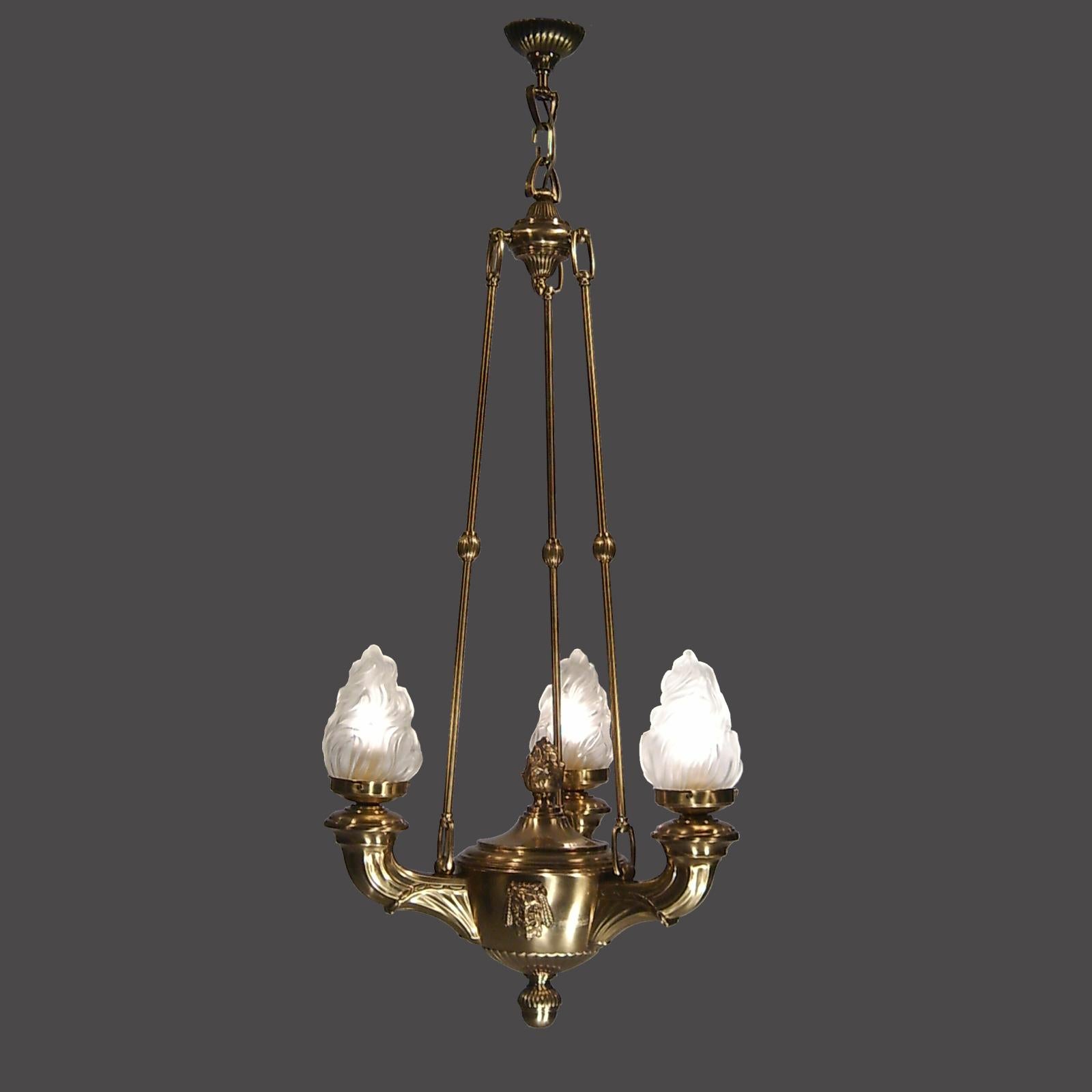 Brass chandelier with glass-shades.

Measures: Technical data
Height 100 cm (39.37 inch)
Ø 45 cm (17.72 inch)
Power: 3-6W-LED 

All components according to the UL regulations.