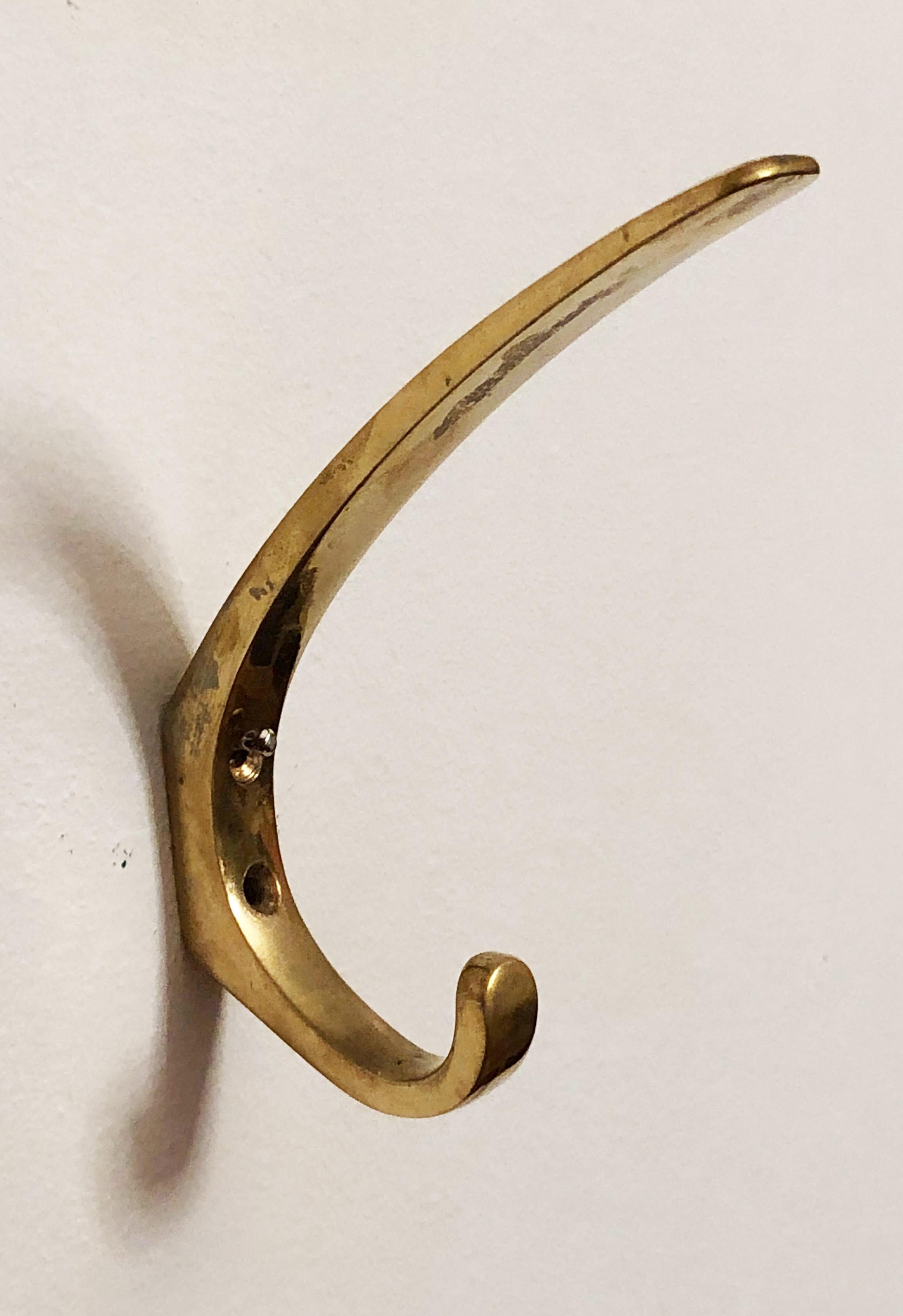 Brass coat, hat hooks, elegant shape and perfect quality by Hertha Baller from the 1950s.
 