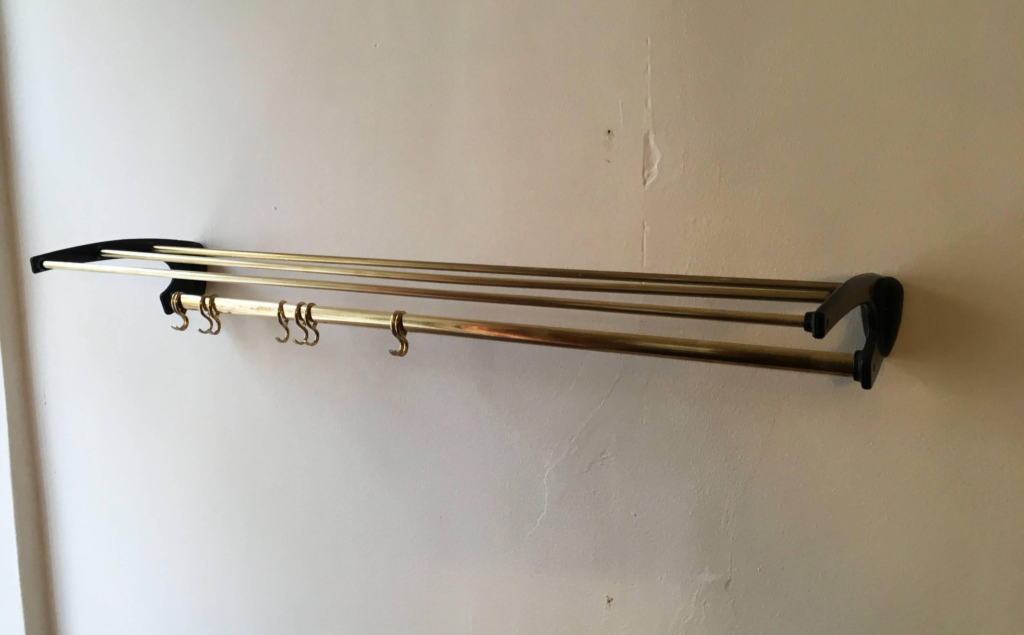 Brass with black plastic side parts, made in Austria in the 1960s.
Up to three pieces available.