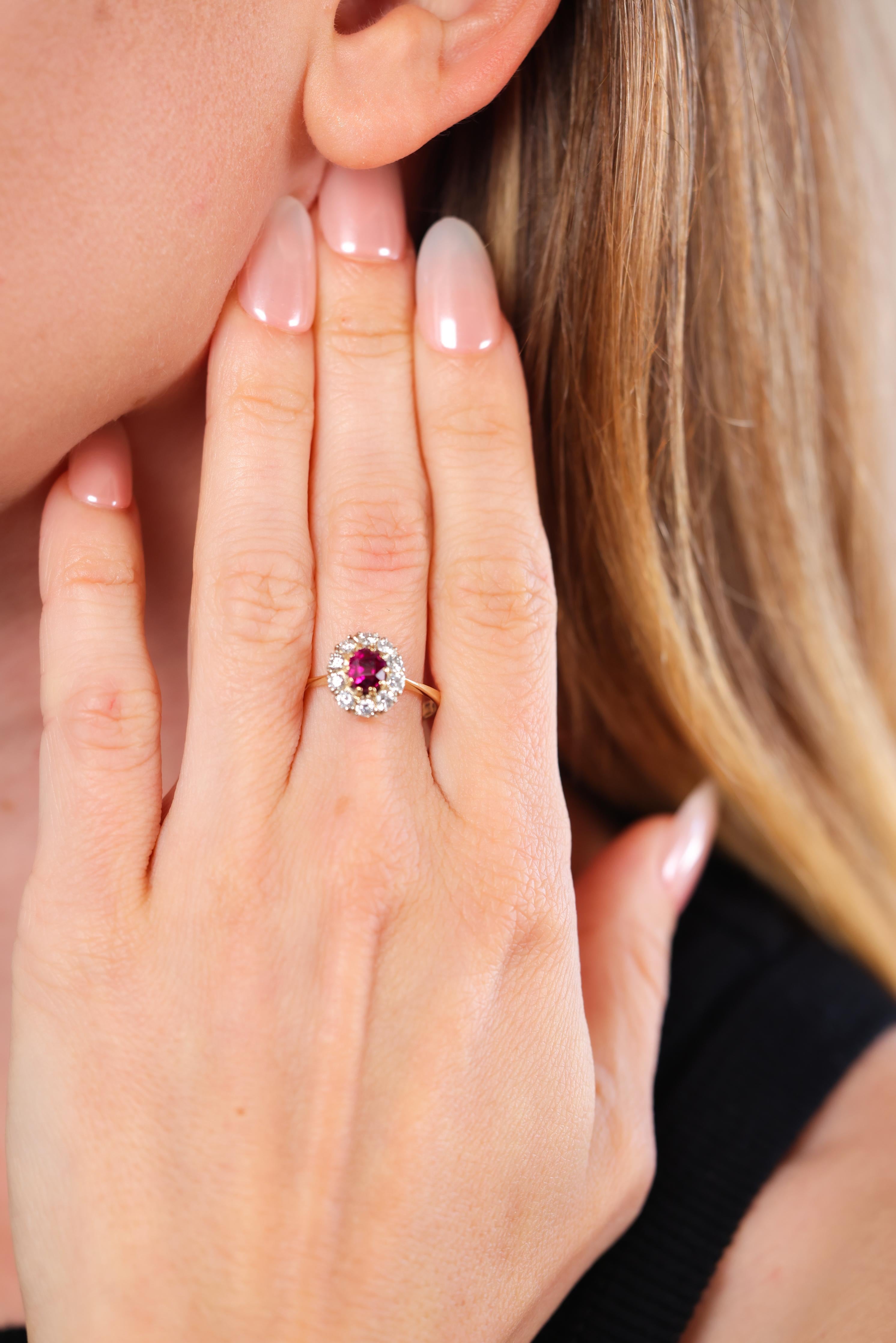 Cushion cut ruby approx 1.10 carat 
10 round cut diamonds approx 0.40 carat 
G-H color
VS clarity 
14k gold with purity marks 
Austrian hallmarks 
Mid Century style Circa 1950s 
Ring size 8-3/4 and can be resized 
4.1 grams 


Embrace the vintage