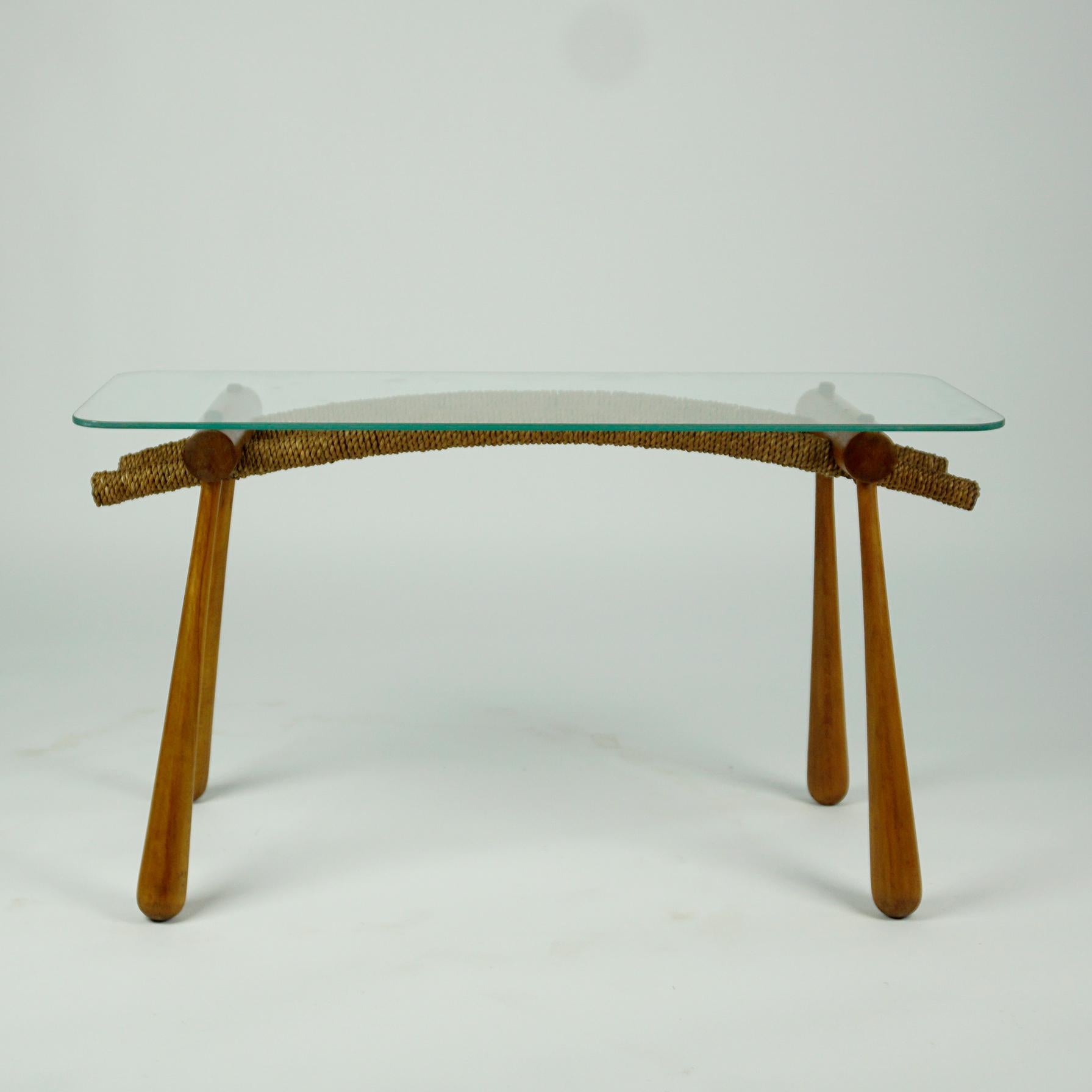 Amazing Austrian midcentury side table or coffee table designed by the Austrian Architect Max Kment and manufactured by his Kunstgewerbliche Werkstätte in Vienna in the early 1950s.
The table features a stained beechwood frame, partly wrapped with