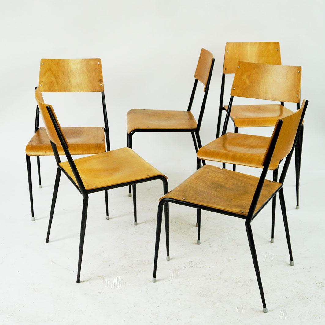 Austrian midcentury bright beechwood stacking chairs Sonett by Karl Fostel Sen.’s Erben Vienna Austria. 
They feature black lacquered steel frames with rubber shoes and bright beechwood seats and backs. They have elegant slim proportions and very
