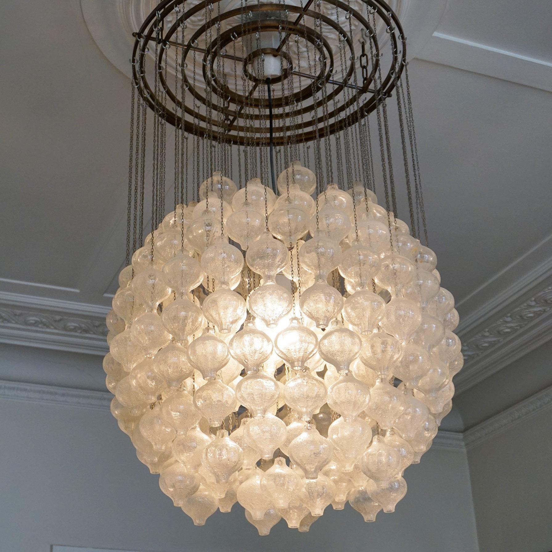 Fantastic and large Kalmar chandelier or Pendant Lamp that consists of numerous blown glass elements which are highly saturated with tiny air bubbles that gives the glass a white look, each element is resting on a nickel chain, elements are hanging