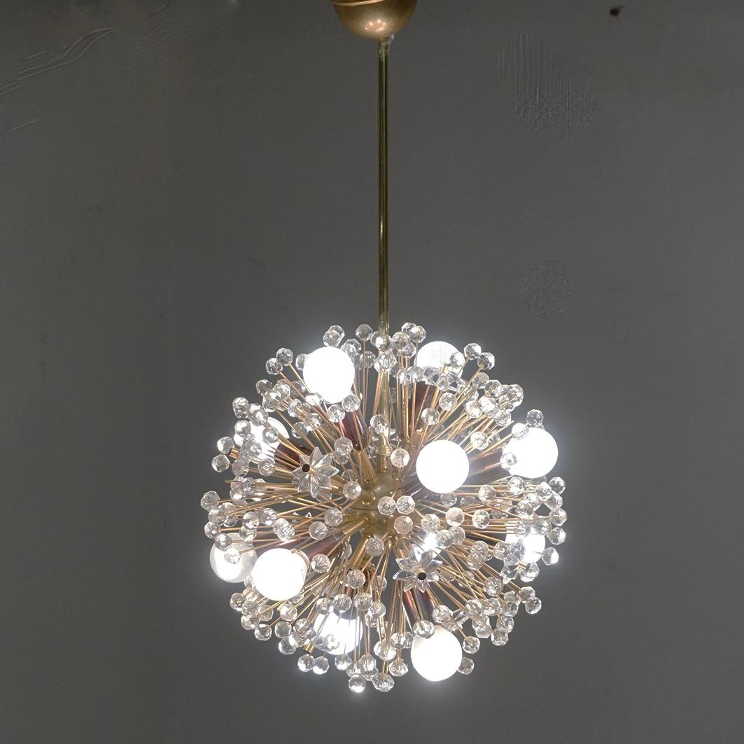 This charming Austrian Midcentury Sputnik or Snowball Chandelier was designed by Emil Stejnar for Rupert Nikoll Vienna 1955 for the Vienna Cafe Ohne Pause Espresso at Graben, one of the most famous streets in Viennas city center.
It features a