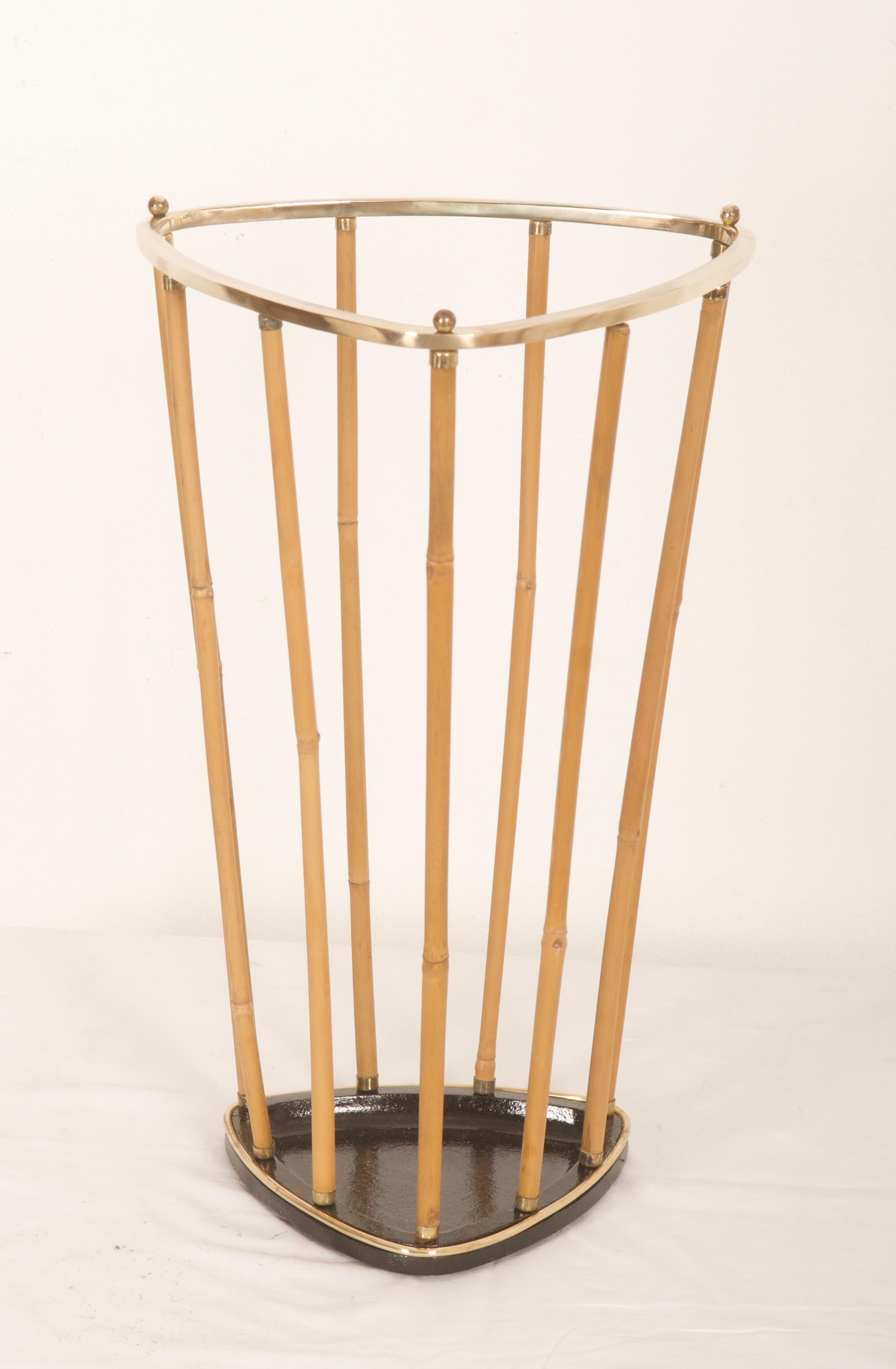 Cast iron base blackened with vertical bamboo rods and brass upper triangular part. Made in Austria in the 1950s. Partially restored
  