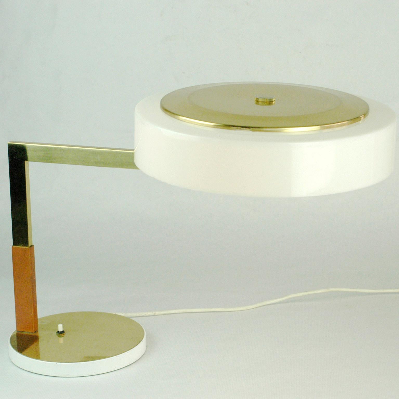 This excellent Austrian midcentury desk lamp with adjustable shade was designed and manufactured by J.T. Kalmar Vienna in the 1960s. It features a brass stem with leather and an acrylic adjustable shade. It has one E27 light socket and is fully
