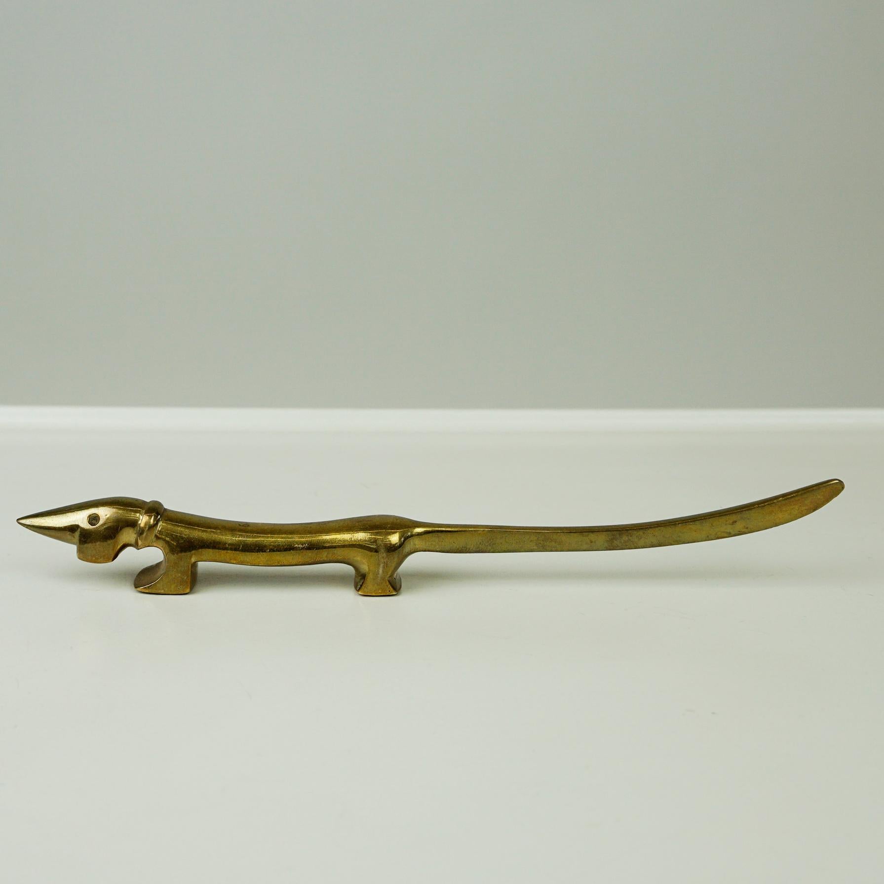 This charming Austrian Midcentury golden solid brass letter opener or paper knife has been designed by Walter Bosse and produced by Herta Baller in the 1950s. The dog features a long tail which is the knife.
A very amazing Highlight for your Desk