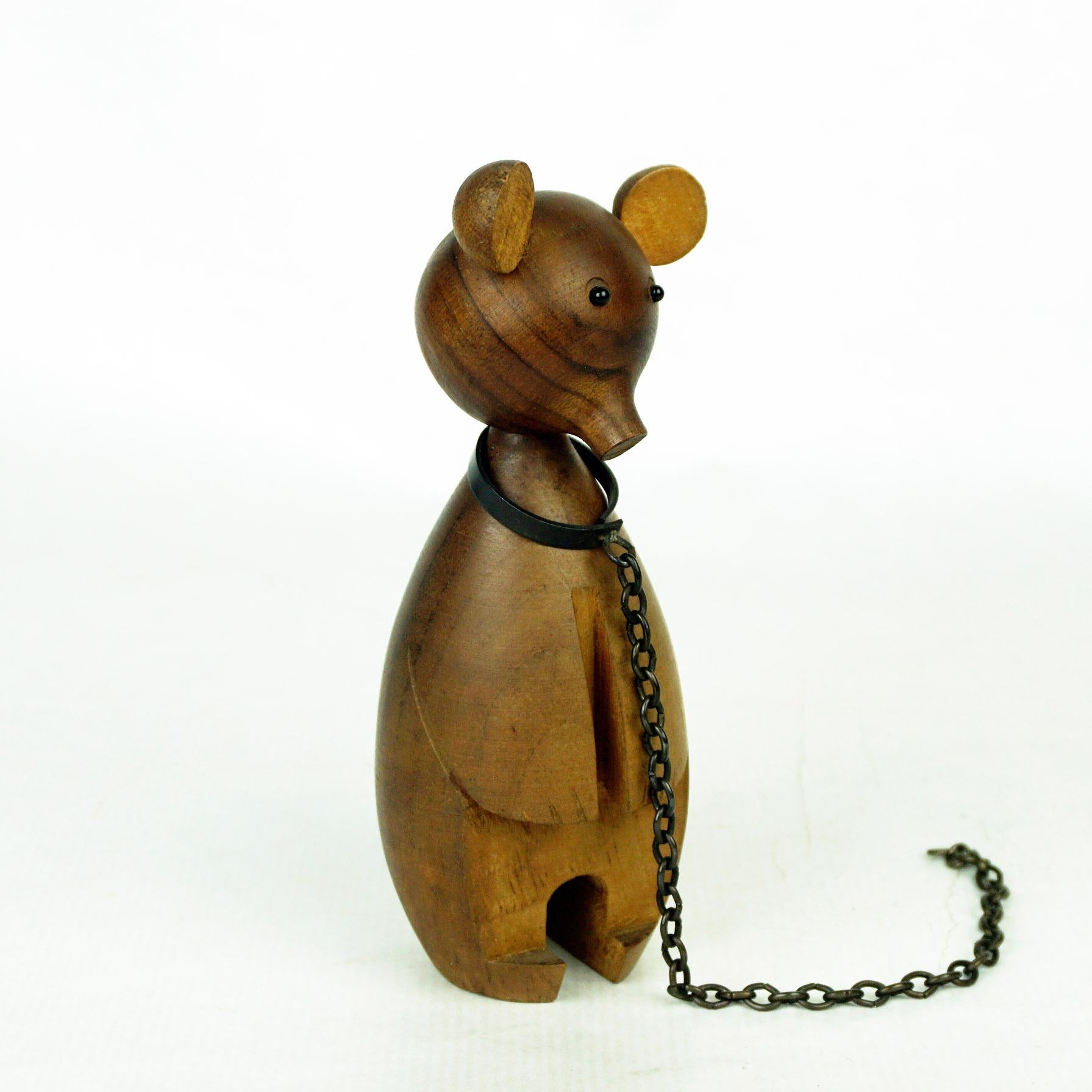 Amazing Austrian 1950s wooden bear, socalled dancing bear with iron chain and glass eyes; perfect minimalistic and characteristic design of the animal. On the underside there are signs of the impressed marks.
  