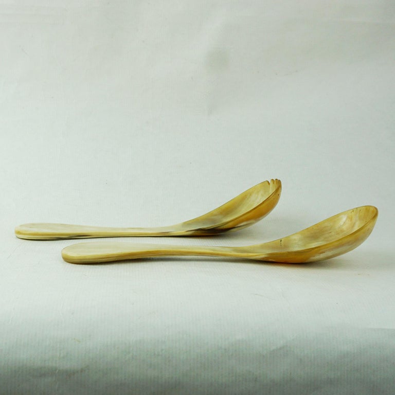 Pair of Austrian modernist horn salad servers designed and manufactured by Carl Aubo¨ck Vienna.