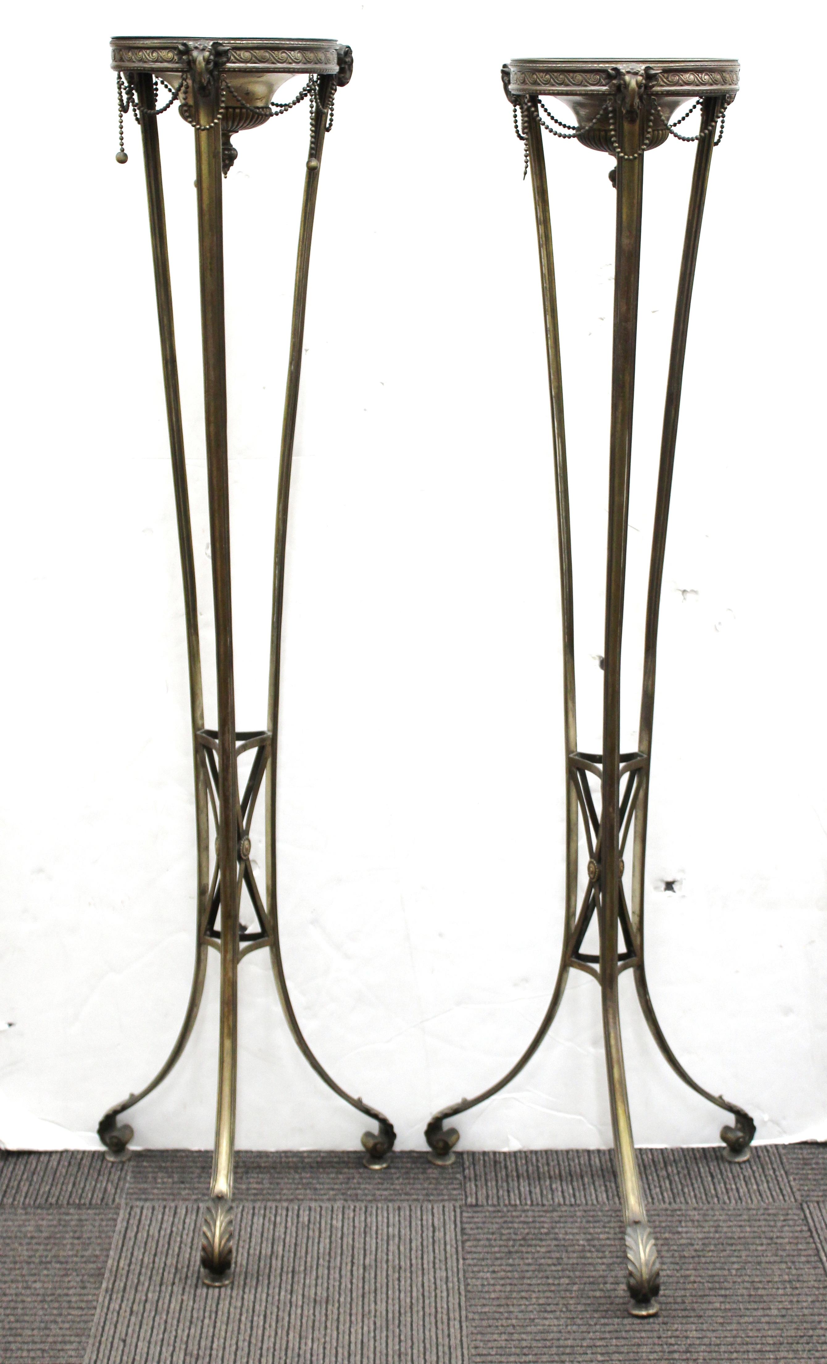 Austrian Neoclassical Revival pair of monumental torcheres in silvered bronze. The pair is not electrified but can be wired to accommodate lamps. Made in Austria during the 1880s. A few chain baubles are missing and the surfaces have age-appropriate
