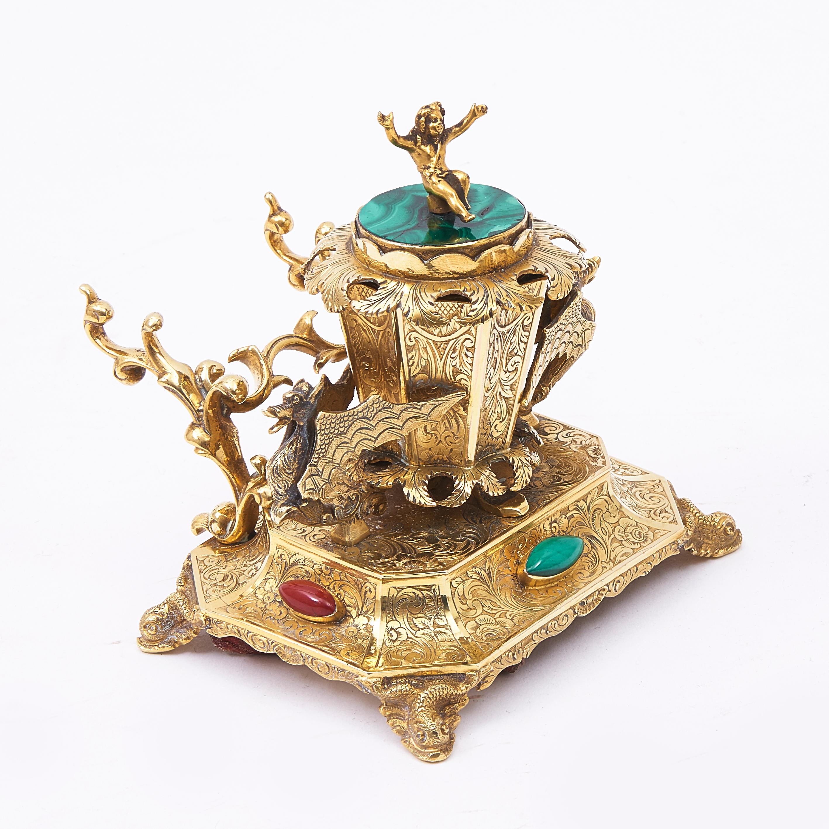 Ormolu desk set ornamented with hardstones, comprising of an inkwell with penholder, candlestick, brush pot and shallow dish, possibly for blotting powder, circa 1850. Each item adorned with decorative foliate engravings and with two mounted