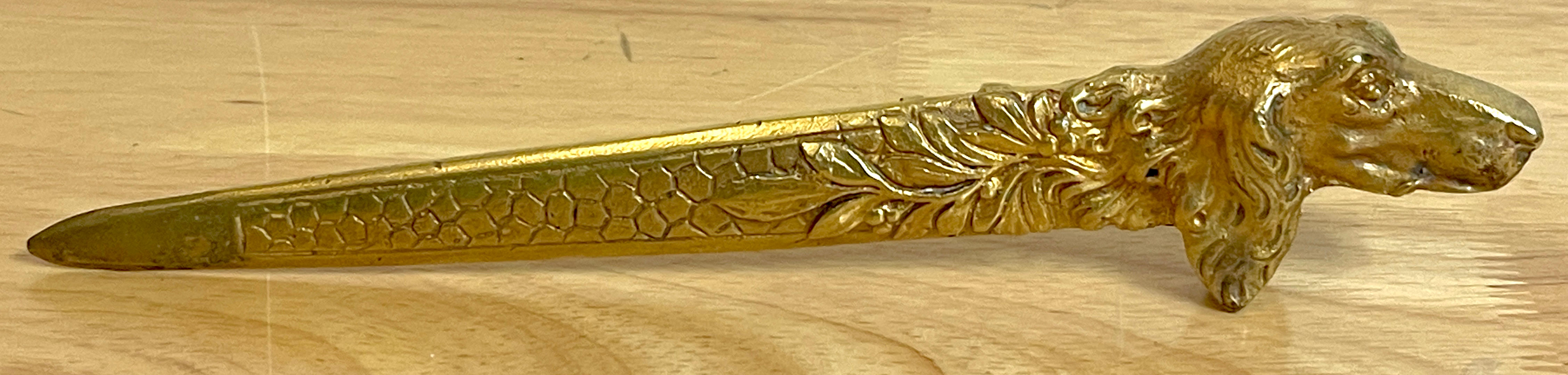 Austrian Ormolu dog motif letter opener, Circa 1900, With subtle art nouveau influences, the well cast ormolu letter opener, rests on either side or upright. Unsigned.
 