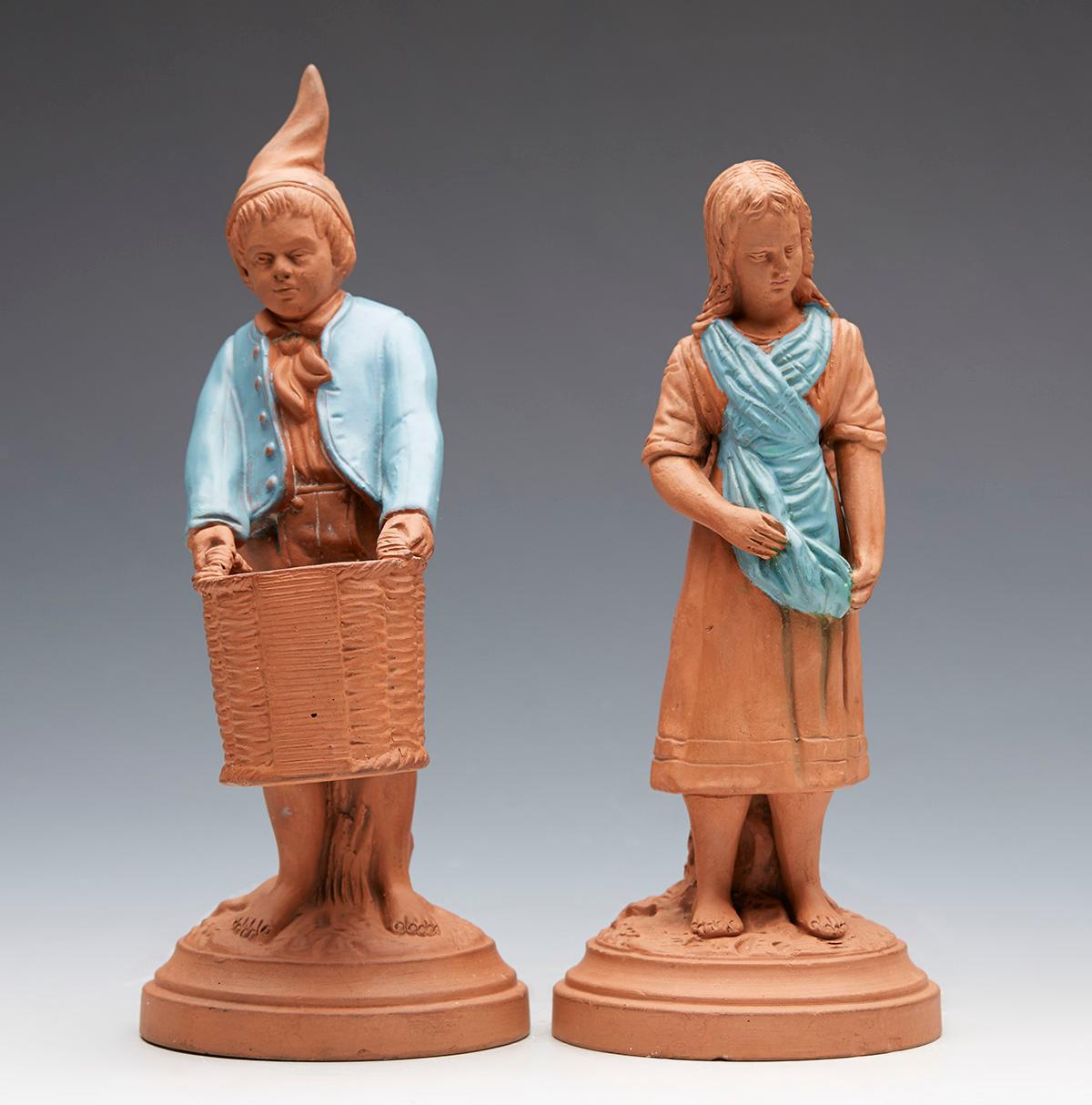 A fine pair Austrian antique terracotta figural match holders and strikers dating from around 1890. The figures comprised of one modeled as a girl carrying a basket on her back with a match striker to the base and the other is modeled as a boy