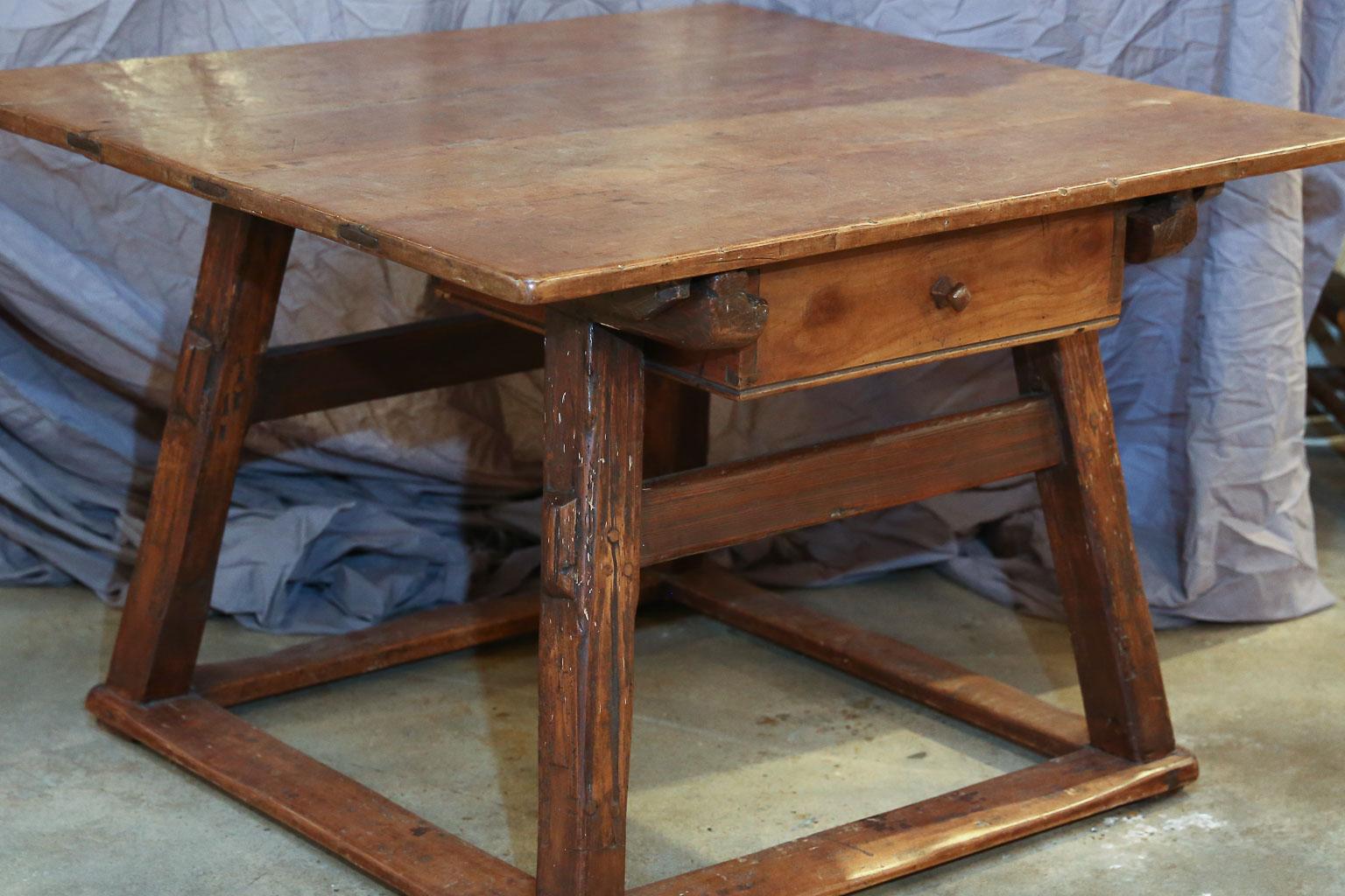 This Austrian payment table dates from the 1800s. This charming table is almost square and features one large drawer. It would be a beautiful statement piece in an entry hall or as a small dining table.