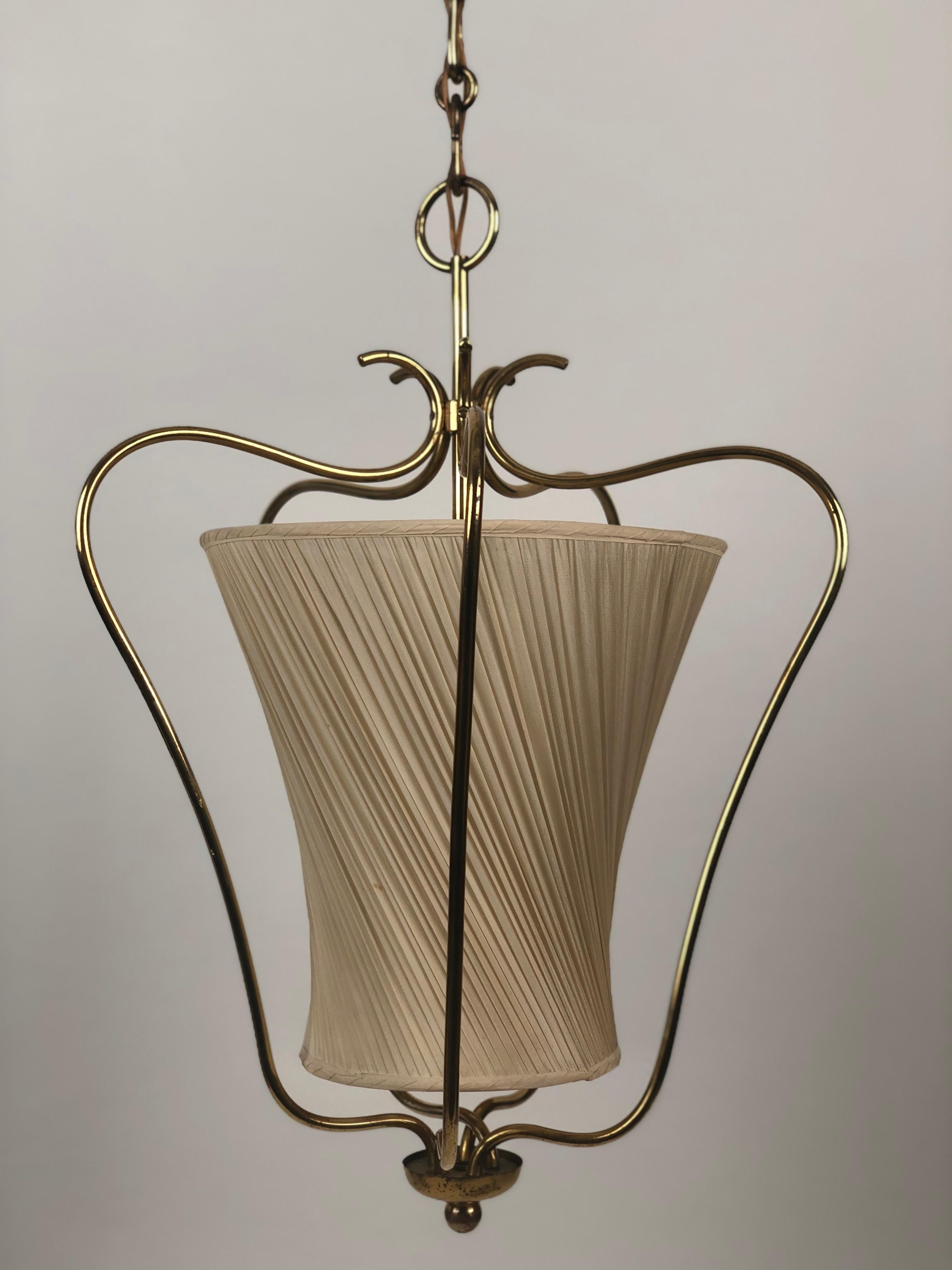 Brass pendant lamp from Rupert Nikoll with original silk shade. This lamp is in very good condition with a lovely patina. The styling is inspired from Regency. This is a very elegant design

The electric has been tested and all the elects are in
