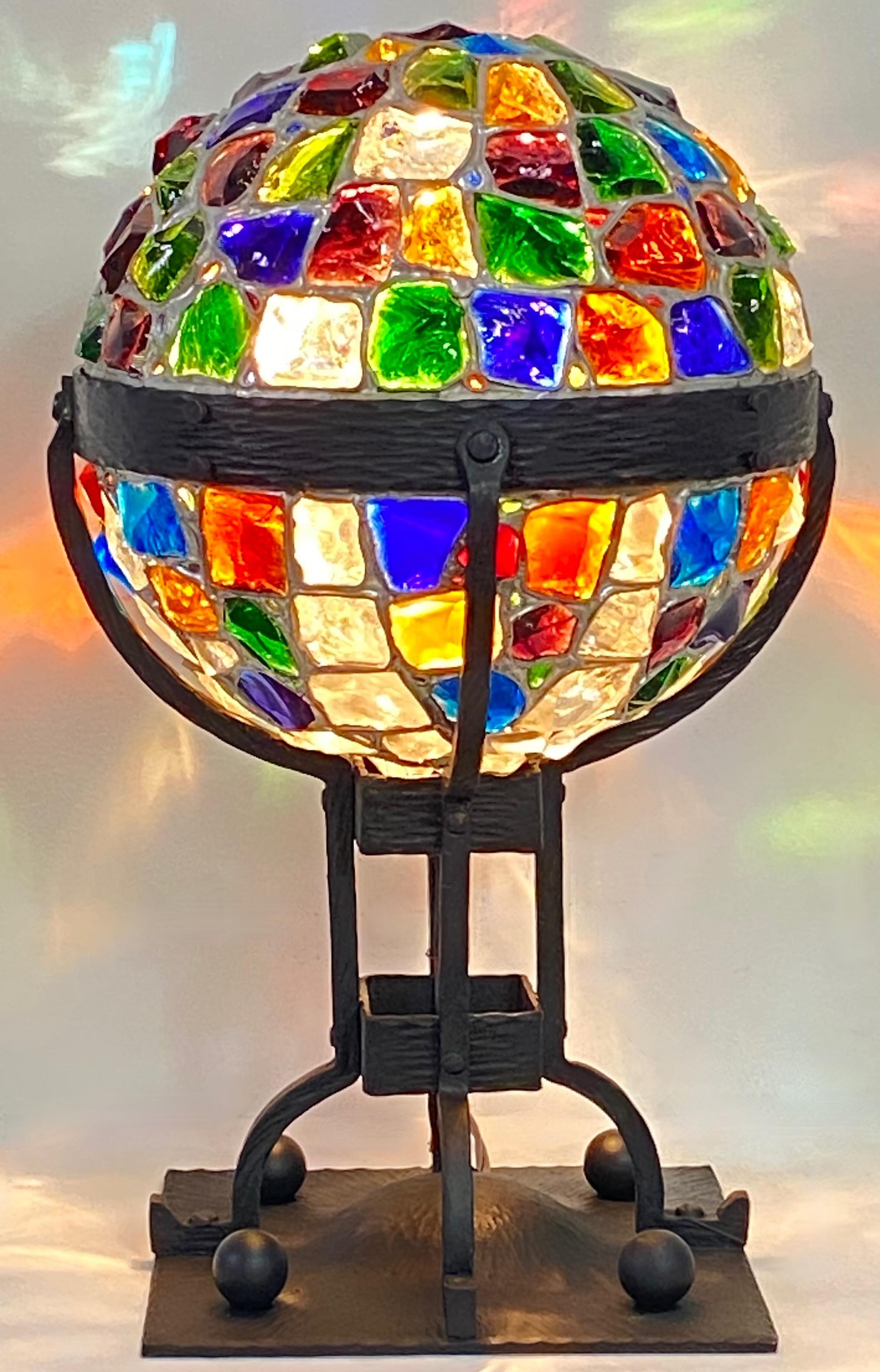 An unusual Secessionist period colorful glass chunk jewel newel post lamp. Wrought iron with colorful hand cut glass jewels in vibrant colors.
Arts and Crafts - Art Nouveau Style
Recently restored and re-wired. 
The square base measures 8 inches