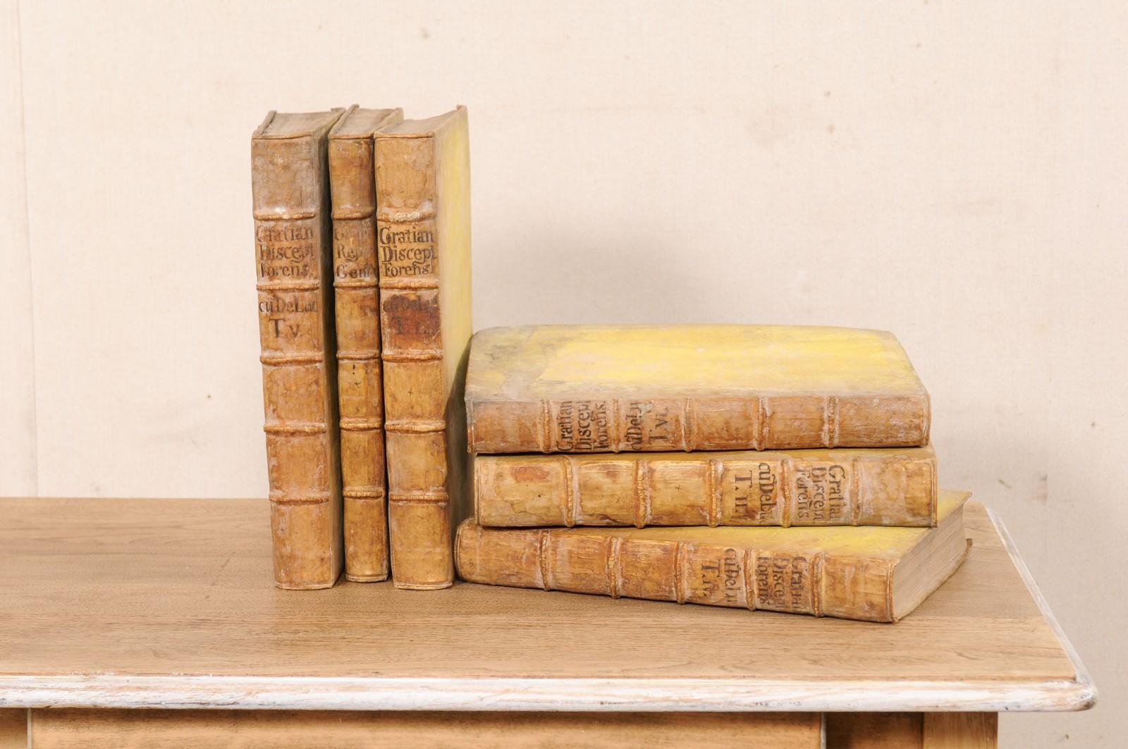 A handsome collection of 6 Austrian vellum bound books from the late 17th century. This antique set of six books from Austria, which retain their original vellum bindings, have Latin writing and will make fabulous decorative objects. Should you