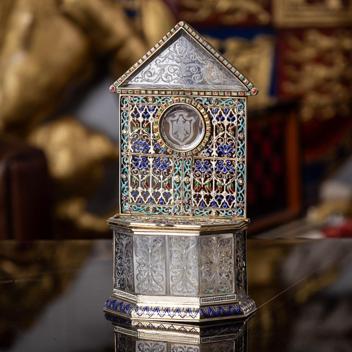 Antique 19th century Austrian rare and unusual solid silver-gilt and enamel reliquary, pierced and decorated with multicolored enamels, sides set with carved rock crystal panels and a carved plaque depicting a crest of the city of Vienna, the hinged