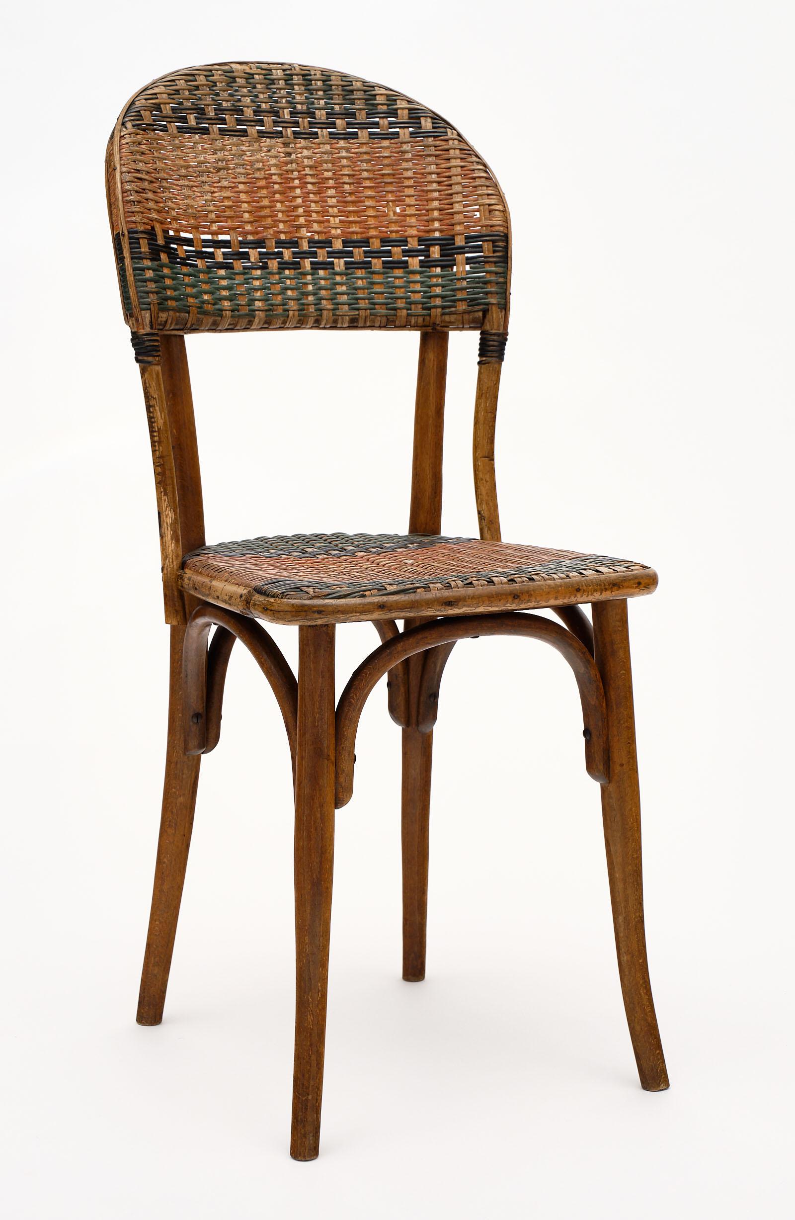 Set of six Austrian Thonet garden/bistro chairs with strong frames and the Classic bentwood Thonet bases. The polychrome wicker seats and backs give dimension and a Classic affect. By iconic Thonet.