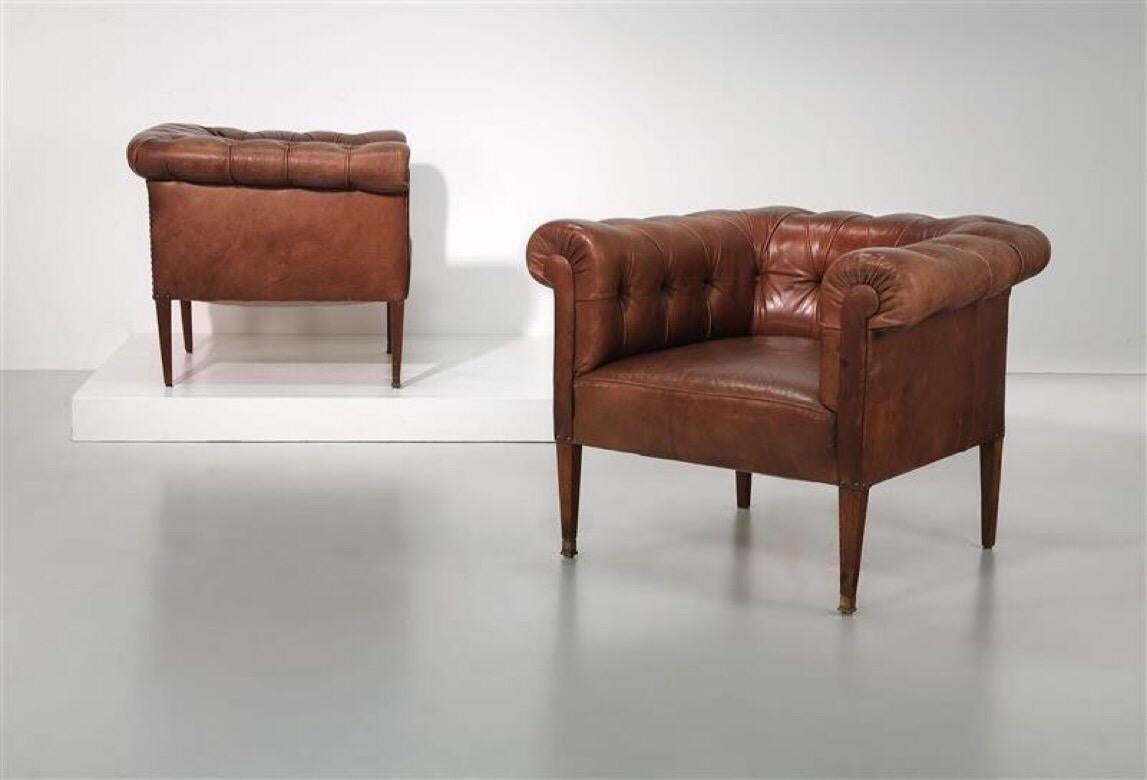 Two armchairs, designed by Adolf Loos, Vienna, circa 1905, four-legged hardwood construction, brass shoes, upholstered, partly textured brown leather upholstery. Cover and upholstery expertly renewed some time ago.
Measures: Height about 70 cm,