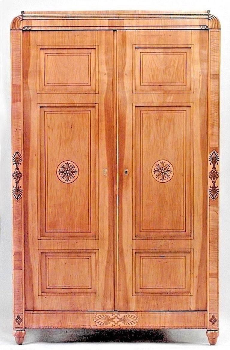 Austrian Viennese Biedermeier (Circa 1830) maple armoire cabinet with 2 doors and inlaid trim with fluted design pediment

