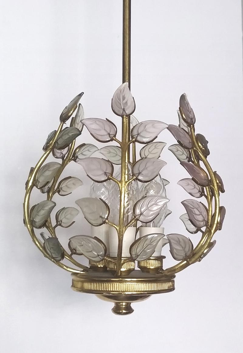 Wonderful mid century green, clear and rose glass leaves and gold-plated/brass pendant chandelier.
Austria, 1940s.
Measures:
Diameter 9.5 in
Height (body) 10 in.
Lamp sockets: 3, new rewired.

