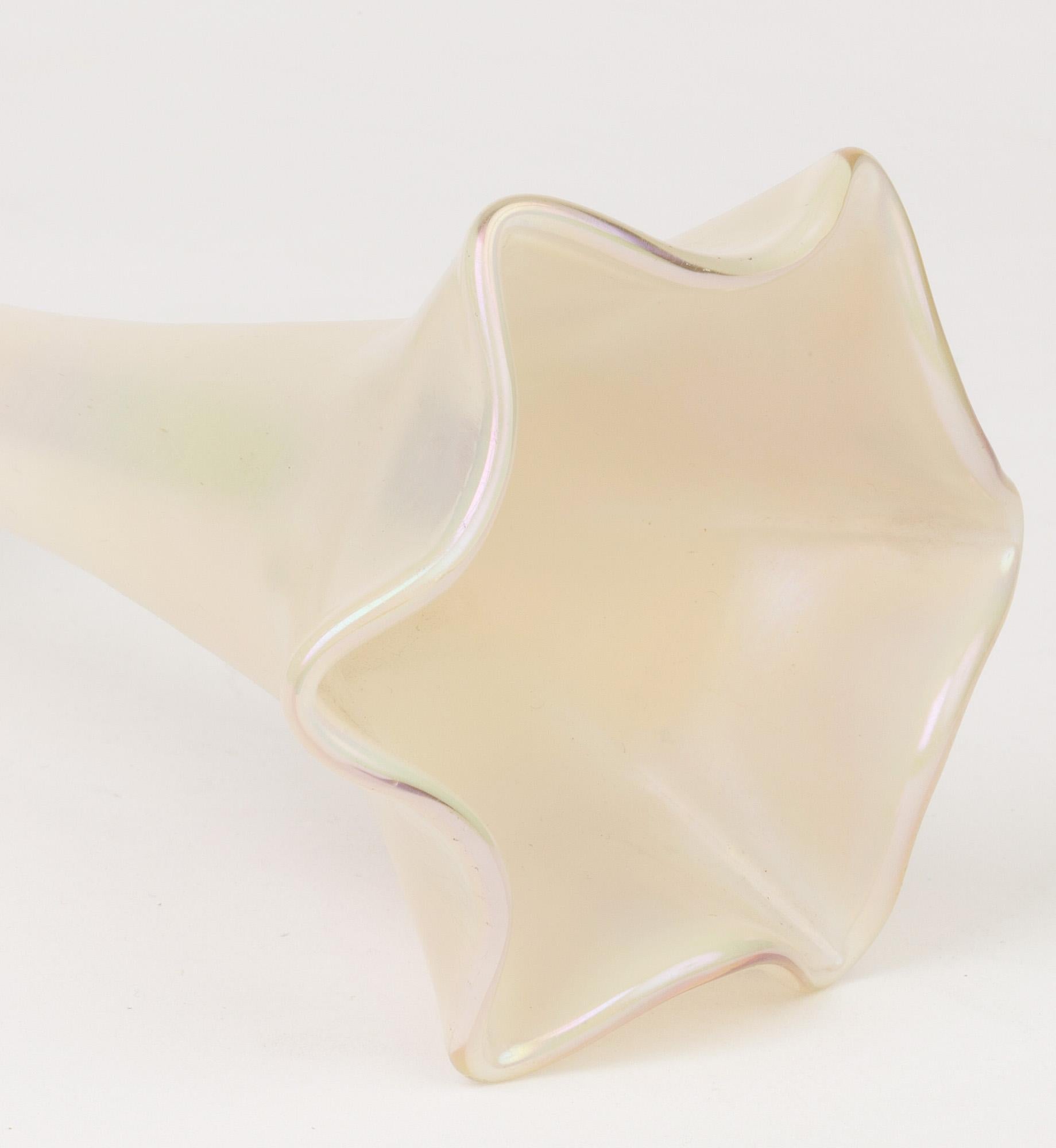 A stunning and quality Art Nouveau Austrian or Bohemian opalescent art glass vase modeled as flower stem with a pinched flower shaped top attributed to Kralik or possibly Loetz and dating from circa 1900. The vase has a thick rounded foot cased in