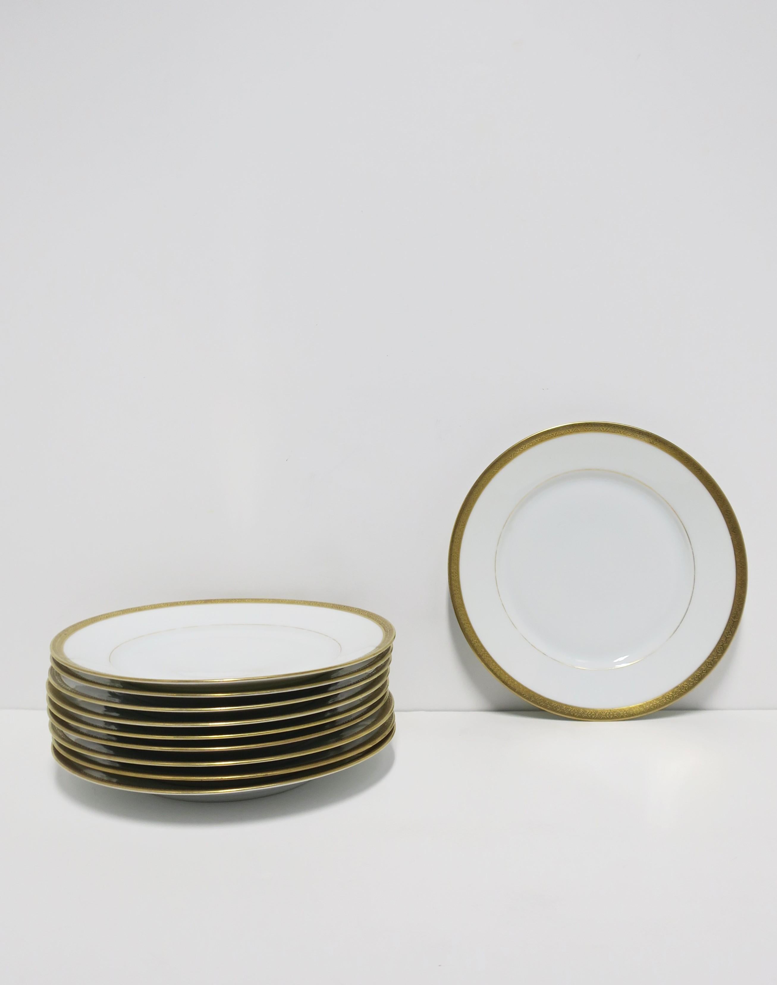 A beautiful vintage set of ten (10) white and gold porcelain plates, circa early to mid-20th century, Austria. Plates have a beautiful gold relief band around edge. Made in Austria as marked on underside of all as shown. A great set of plates to mix