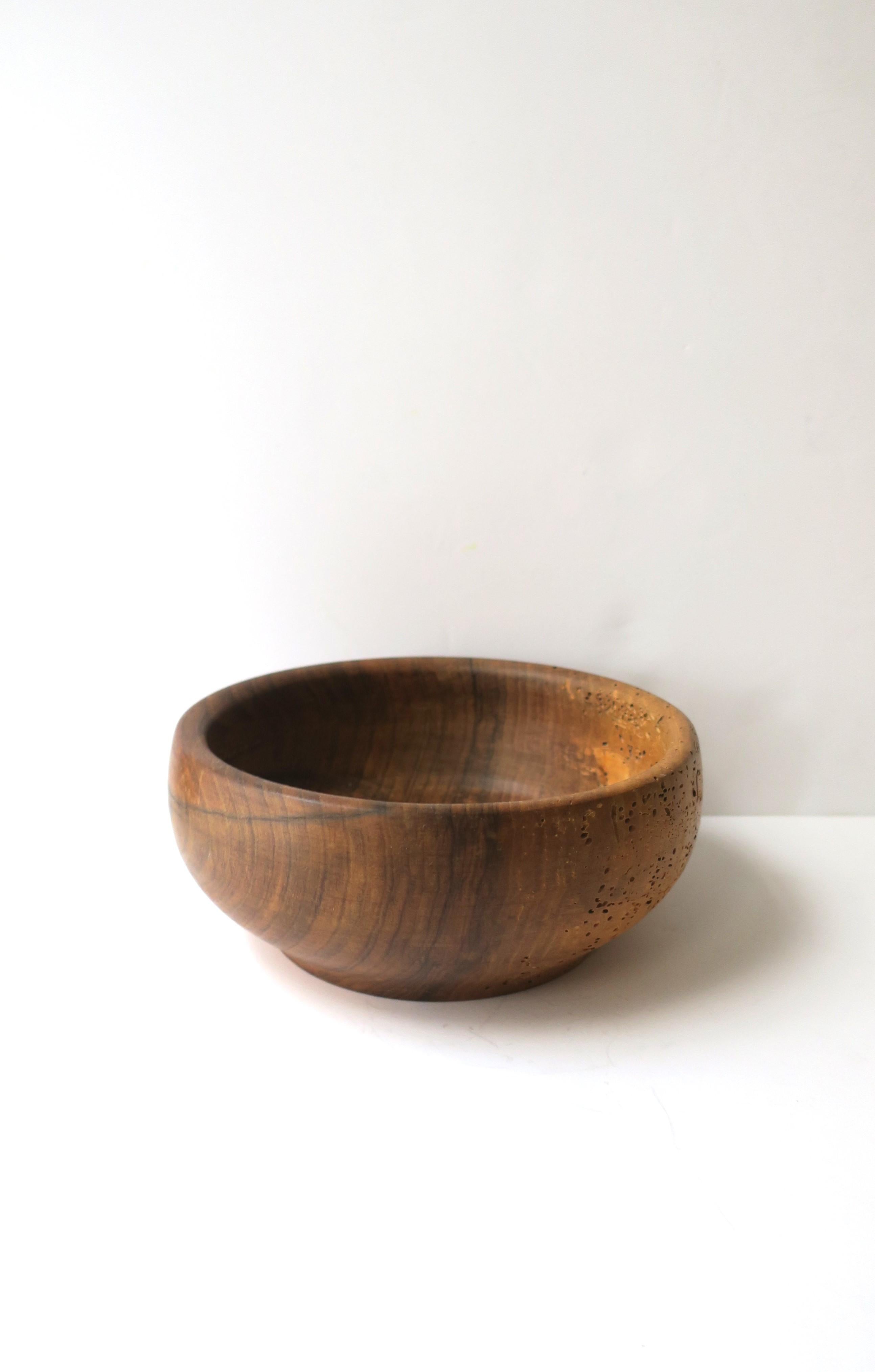 A round Austrian natural wood bowl, hand-crafted, circa mid to late-20th century, Austria. Beautiful as a standalone piece or to hold, display fruit, vegetable, etc. Markers' mark on underside as shown in last image. 

Dimensions: 3.63