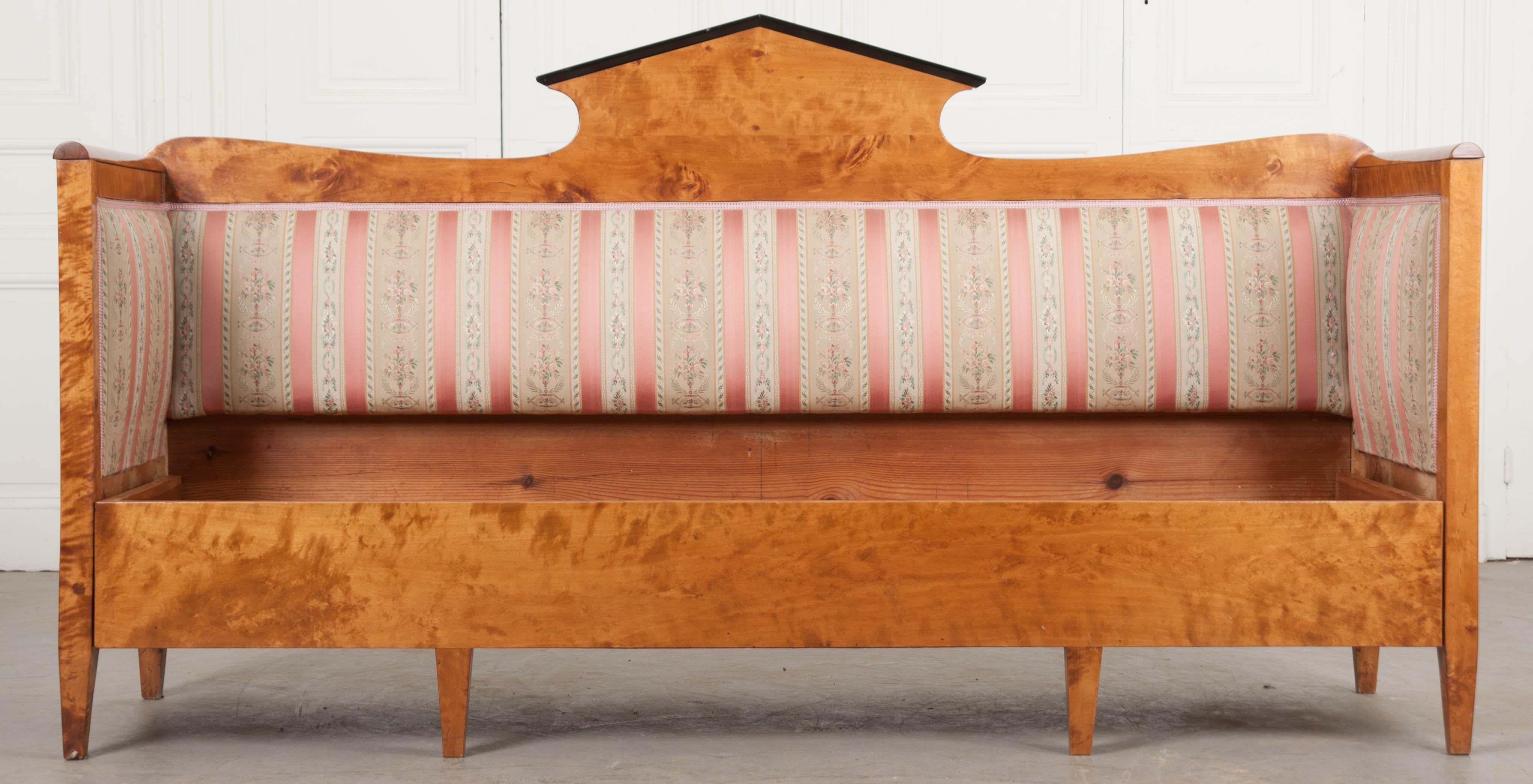 A fabulous Biedermeier style settee from 19th century Bavaria. The settee is made from exceptionally beautiful, solid maple. Some areas have a striped appearance to the grain. This is known as “tigering”. The sofa’s back has a central pointed