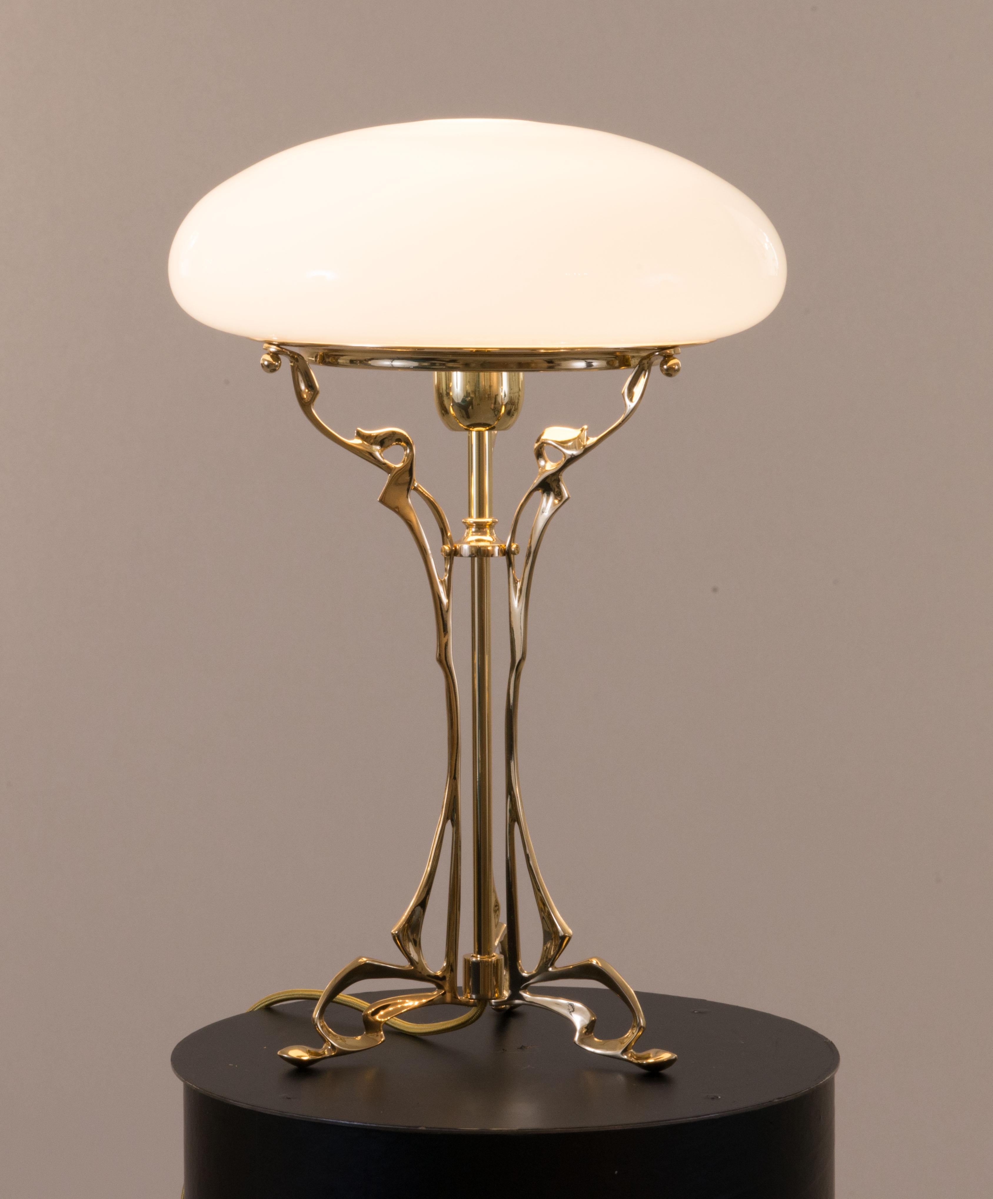 An excellent example of floral Jugendstil.
Hand formed sand casted brass-parts, hand blown opaline-glass.
Can be fixed on a table as well

Most components according to the UL regulations, with an additional charge we will UL-list and label our