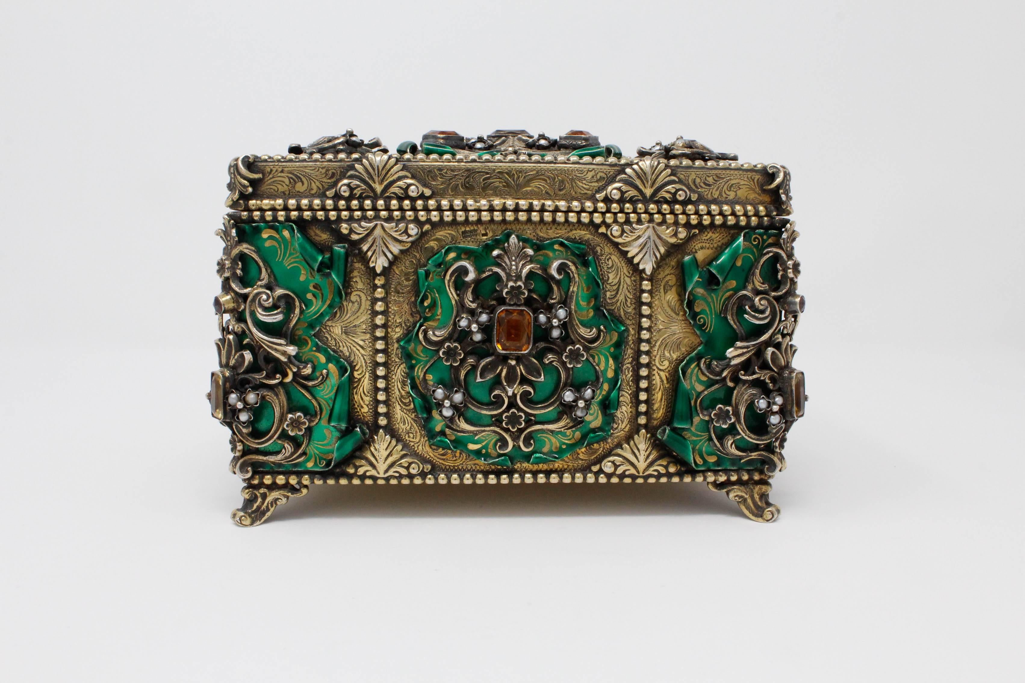 Austro-Hungarian Jewelled Casket. C. 1900, made in Hungary. Hand engraved 925 Silver Gilt and Enamel. Set with Citrines, Pearls, and Garnets. Shown unpolished with natural patina. One citrine replaced with synthetic sapphire. 7 inches wide, 4.5