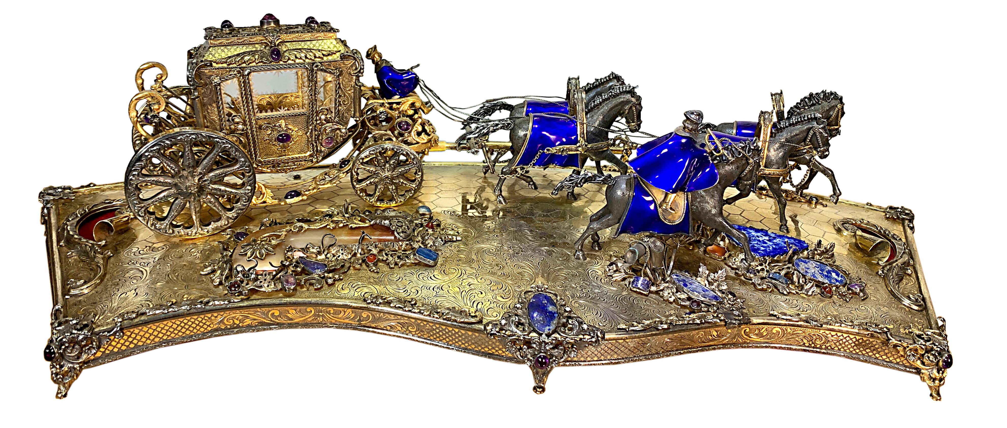This magnificent Austro-Hungarian silver parcel gilt model of horse-drawn carriage features a total of five gracefully galloping horses. four horses pulling a majestic carriage mounted with various semi-precious stones with driven by a coachman; the