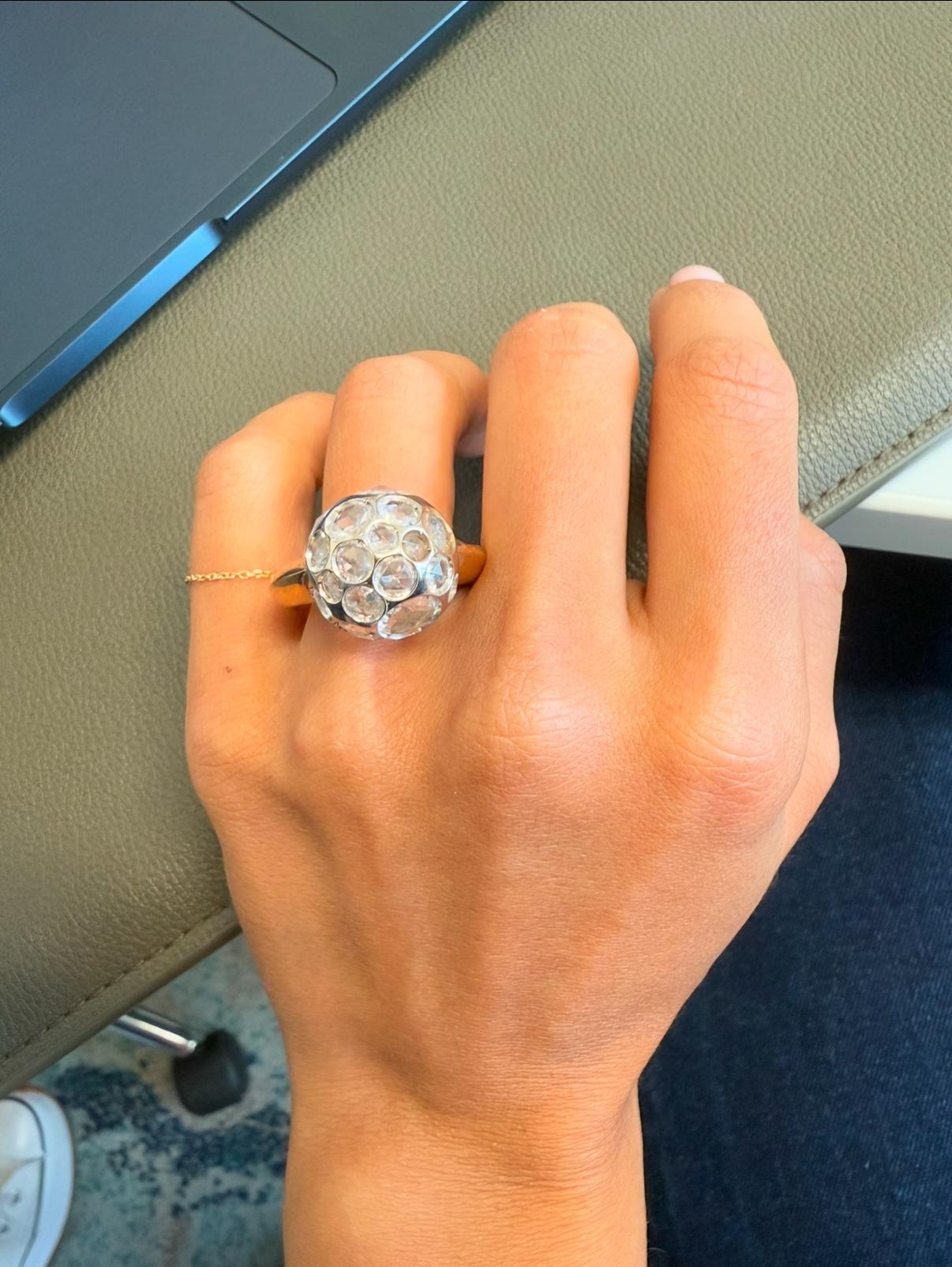 This is a gorgeous authentic ring by designer Pomellato from her Harem Collection. It is crafted from 18k rose gold featuring a 17mm gold ball with assorted round shape cut out frame, it is attached between a thick shank and tapered band, the ball