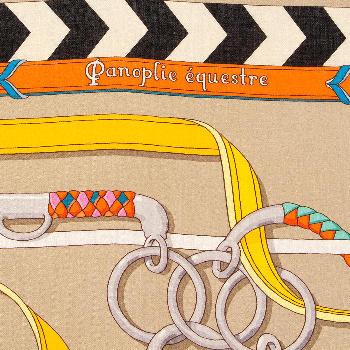 Hermes 'Panoplie Equestre 140' shawl by Virginie Jamin in beige cashmere (70%) and silk (30%) with details in yellow, grey, mint, orange and black. Has been worn and is in excellent condition.

Width 140cm (55in)
Height 140cm (55in)