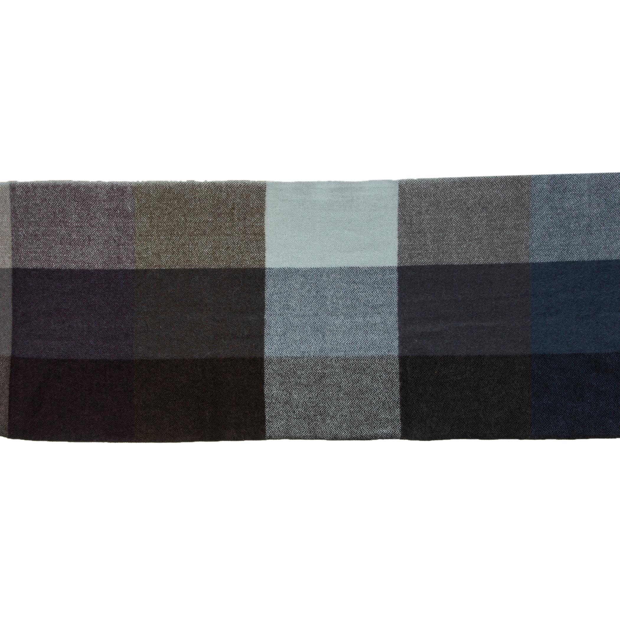 Hermes plaid shawl in navy, petrol and soldier blue, black and grey cashmere (50%) and yak (50%) with fringed ends. Has been worn and is in excellent condition.

Width 42cm (16.4in)
Length 233cm (90.9in)