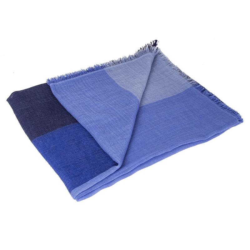 Hermes 'Colorblock' shawl in midnight blue, royal blue, periwinkle and baby blue herringbone cashmere (100%). Has been worn and is in excellent condition.

Width 155cm (60.5in)
Length 205cm (80in)