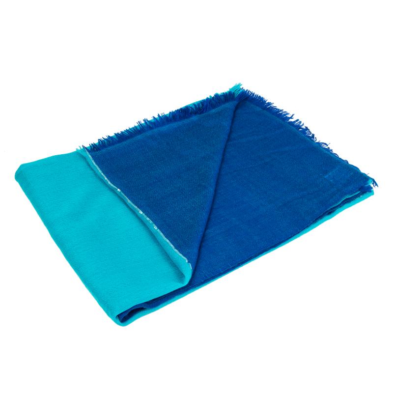 Hermes shalw in turquoise and dark blue cashmere (100%) with metallic silver lurex strip down the middle. Has been worn and is in excellent condition.

Width 155cm (60.5in)
Length 205cm (80in)
