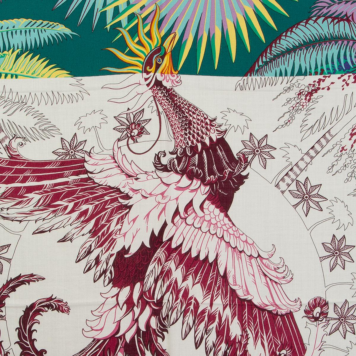 Hermes 'Mythiques Phoenix 140' shawl by Laurence Bourthoumieux in green cashmere (65%) and silk (35%) with navy blue hem and details in turquoise, lilac, burgundy, yellow and white. Has been worn and is in excellent condition.

Width 140cm