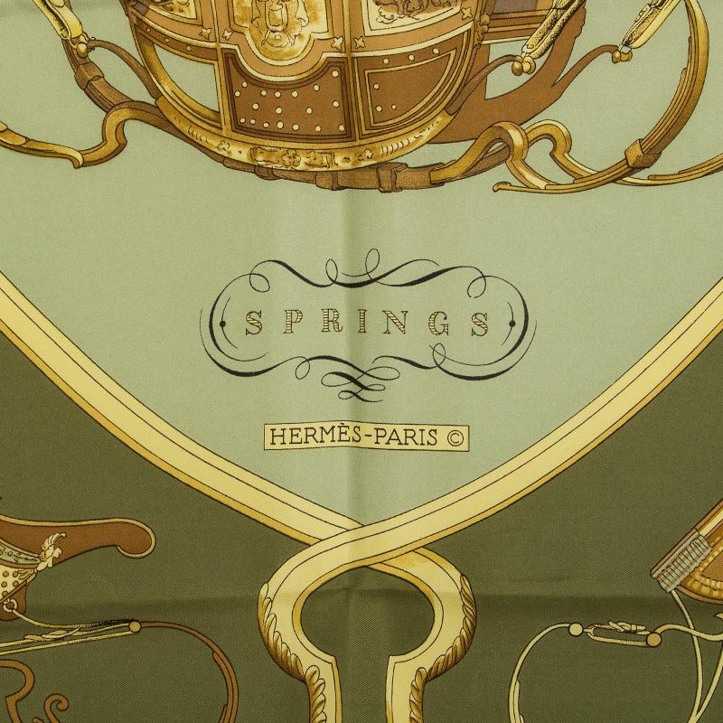 Hermes 'Springs 90' scarf by Philippe Ledoux in olive green silk twil (100%) with details in celadon green, yellow and bronze. Has been worn and is in excellent condition. 

Width 90cm (35.1in)
Height 90cm (35.1in)