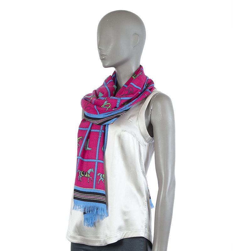 Hermes cashmere/silk stole. Hand rolled hems with fringe ends. Colorway is fuchsia background with details in bright blue, lime green, black, and turquoise. Has been worn and is in pristine like new condition with care tag.

Width 64cm (25in)
Length