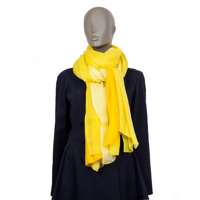 Hermes stole shawl in feather yellow light weight cashmere (100%) with stripes in passenfruit, beige and pale yellow. Handwoven in nepal. Has been worn with hair bit of looser fabric where the lable is attached. Overall in excellent