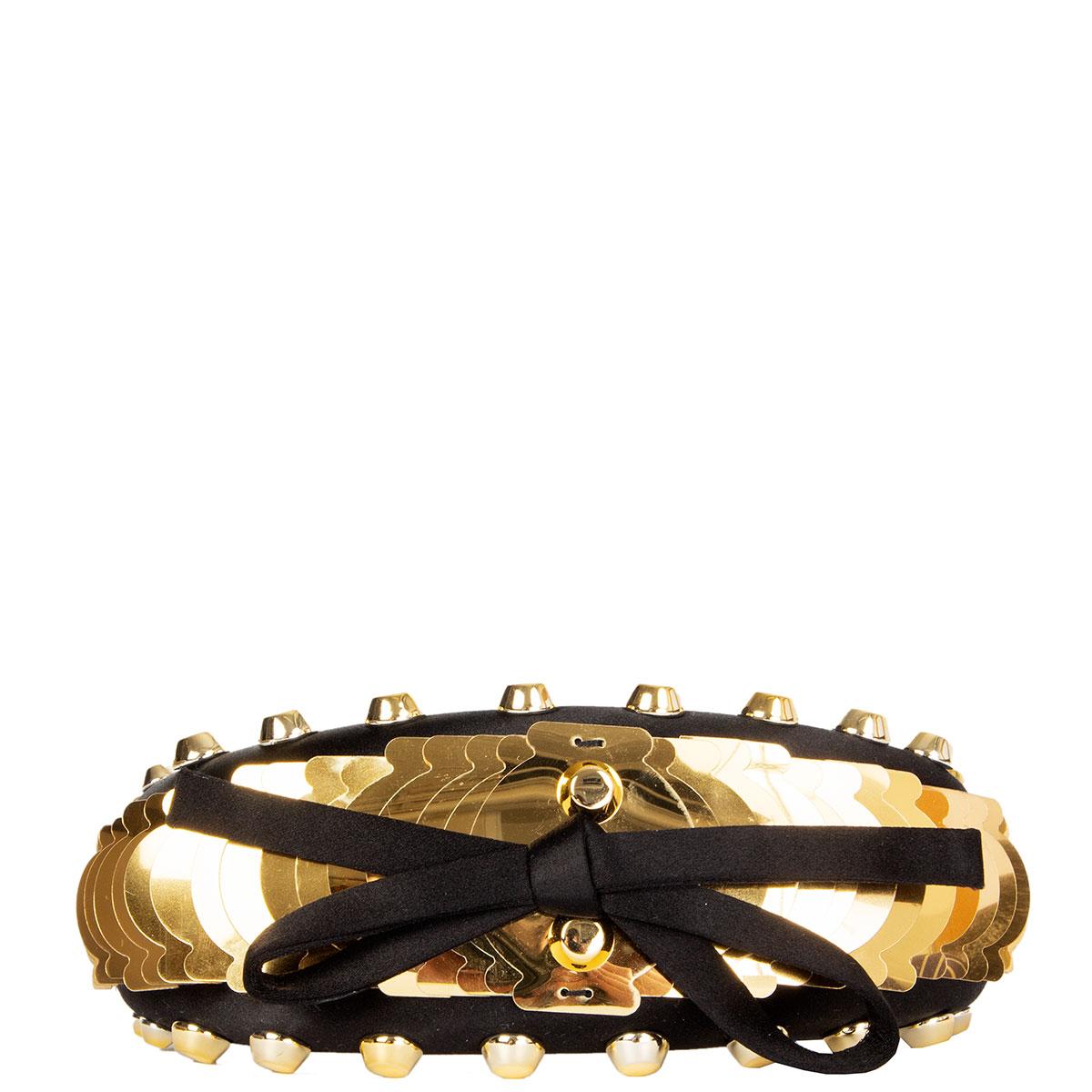 100% authentic Prada studded and embellished gold-tone acetate headband in black satin with bow detail. Has been worn and is in excellent condition. 

All our listings include only the listed item unless otherwise specified in the description above.
