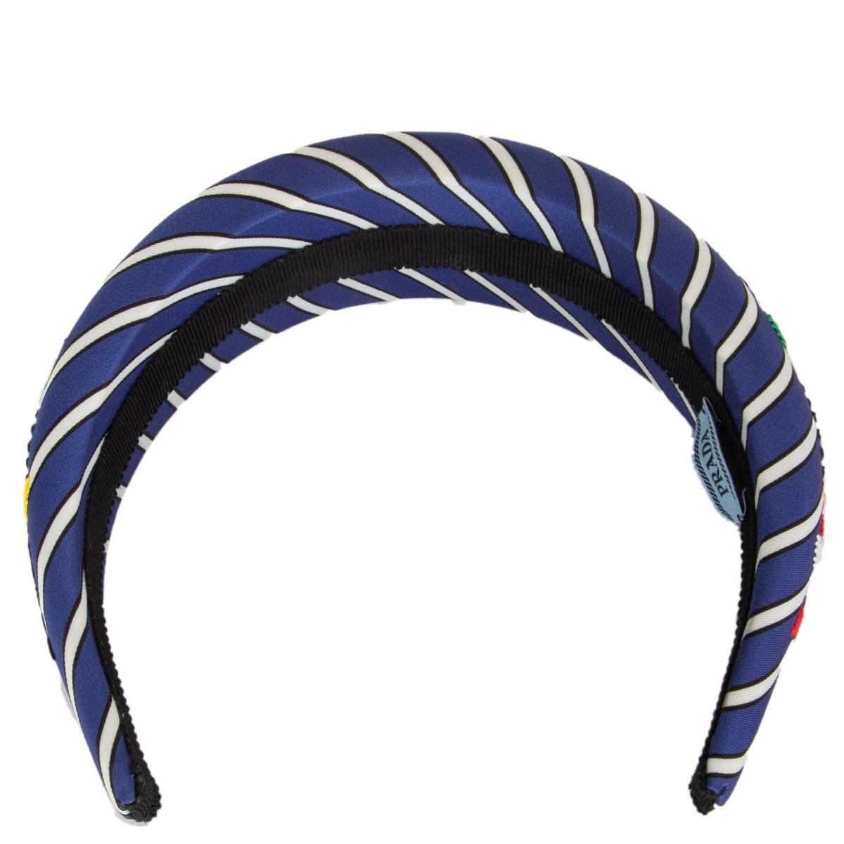 100% authentic Prada striped satin headband in blue and white with red, rose, green and yellow flower embroidery. Has been worn and is in excellent condition. 

All our listings include only the listed item unless otherwise specified in the