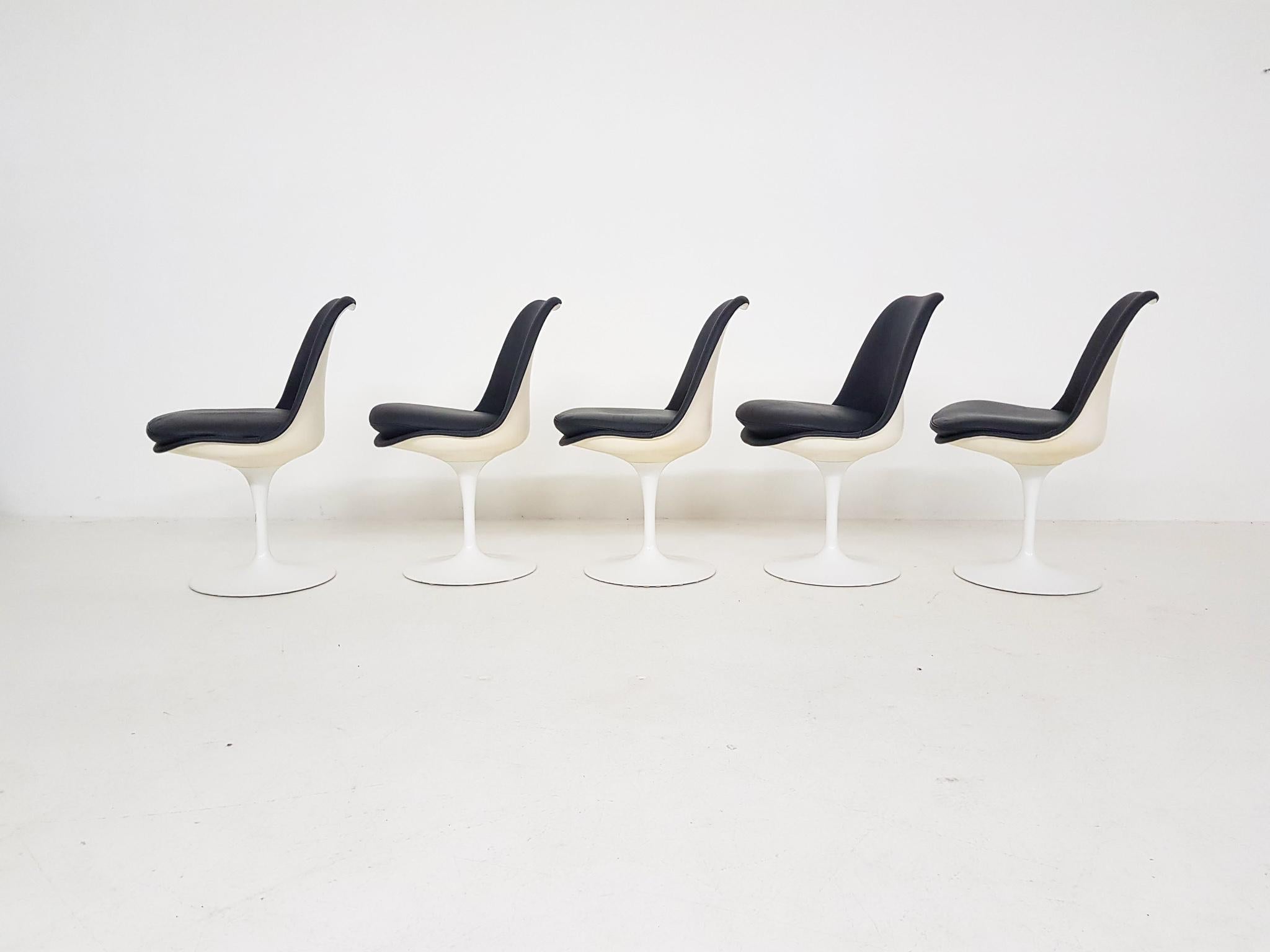 Five original and vintage Eero Saarinen dark blue leather tulip dining chairs for Knoll International, 1969.

These are authentic dining chairs from Eero Saarinen for Knoll International. These chairs were once used in the city hall wedding room of