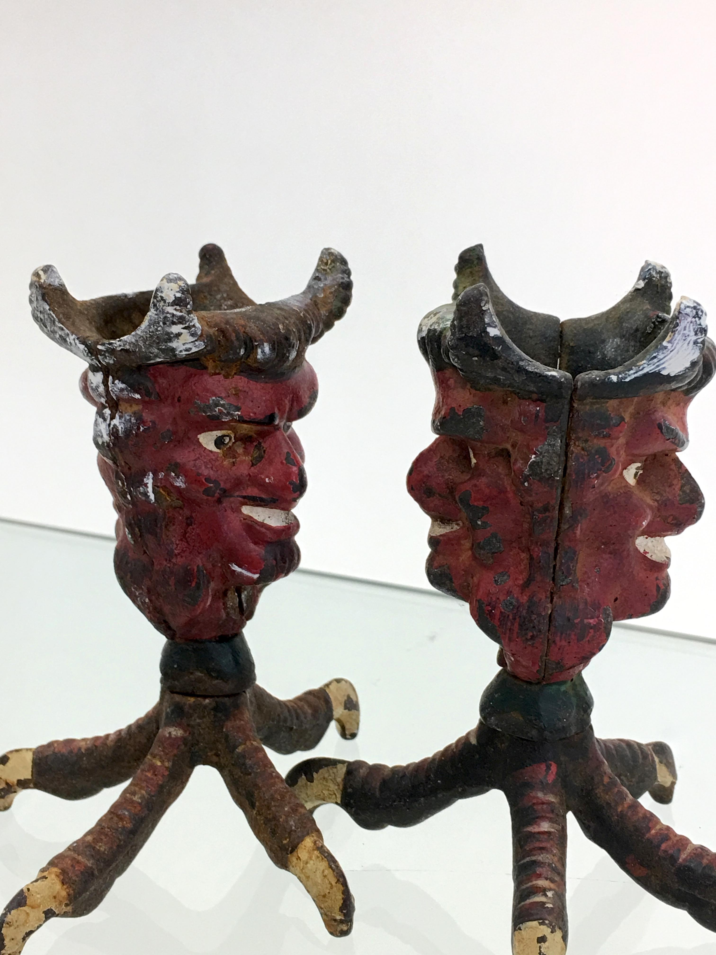 Pair of cast iron Devil Head Candlestick holders.
Measure 4.5