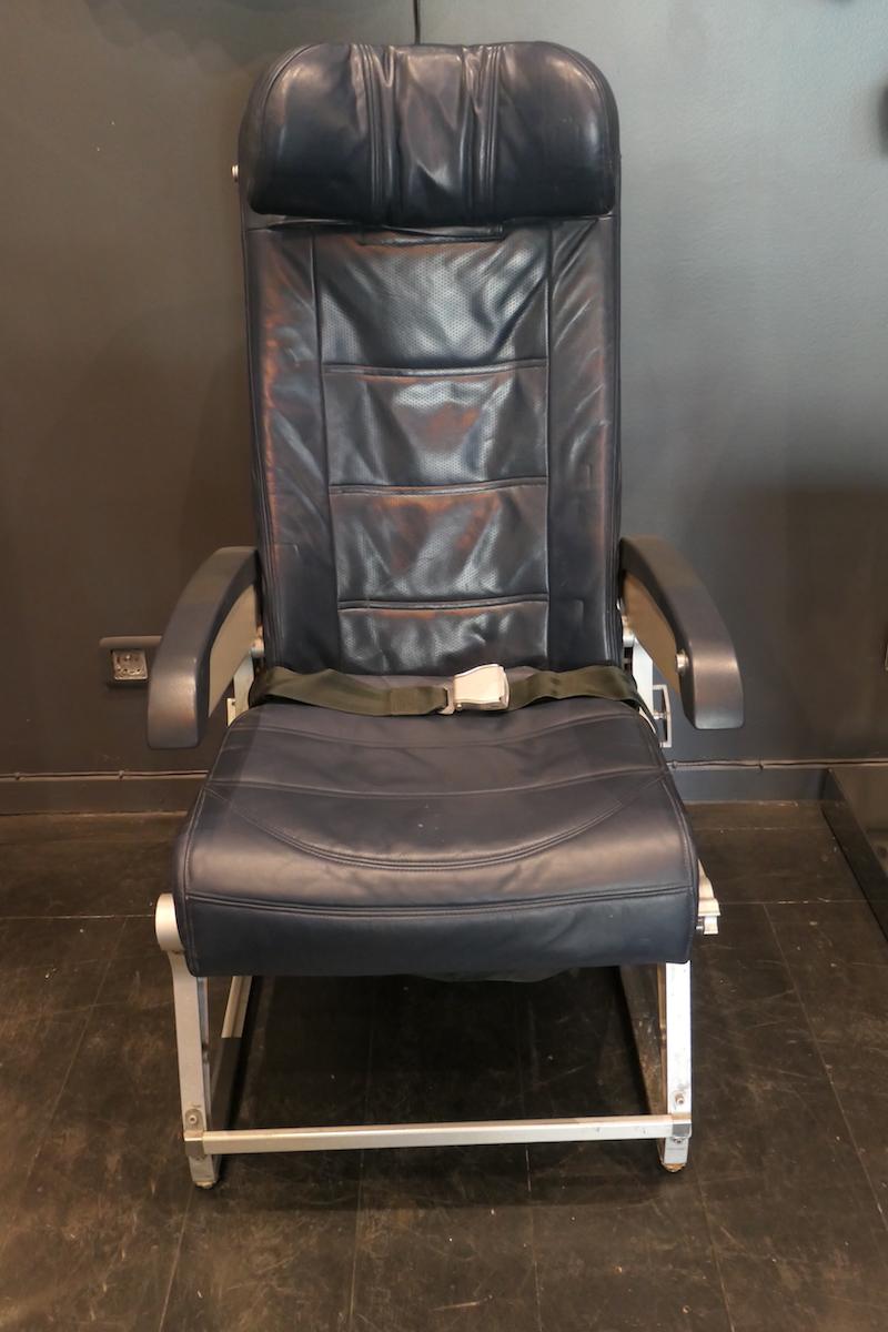 Reclaimed aircraft parts armchair. It is an economy class aircraft armchair covered with blue Skai in good condition on an aluminum structure. Lifting armrest. The tablet on the back of the chair works perfectly.
This authentic aircraft’s part will