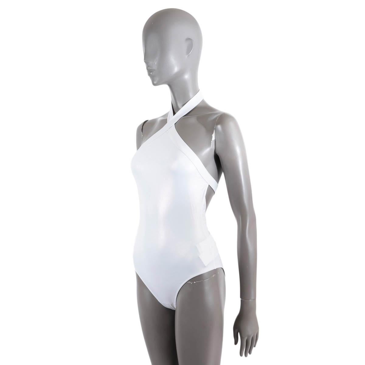 100% authentic Alaïa one-piece halter neck open back swimsuit, made from iridescent white stretch-polyamide (82%) and elasttane (18%). Hook fastening at neck and back. Brand new with tags. Comes with terry cloth dust bag.

Measurements
Tag